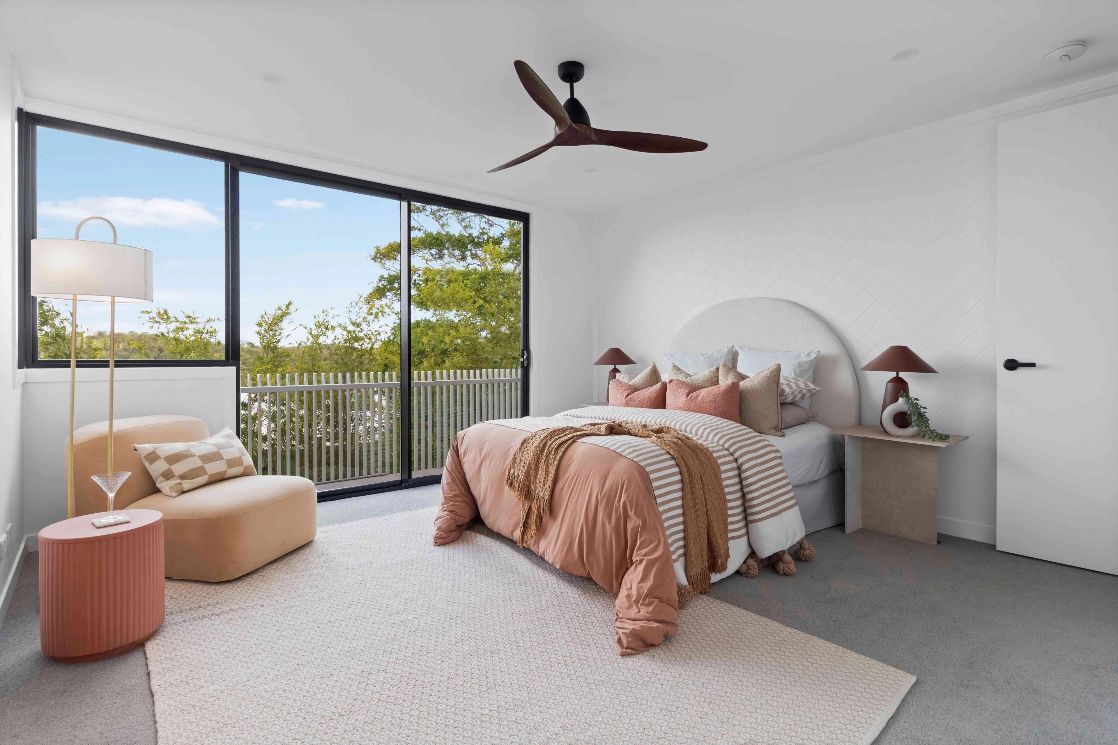 Bedroom with sliding door balcony access and leafy outlook