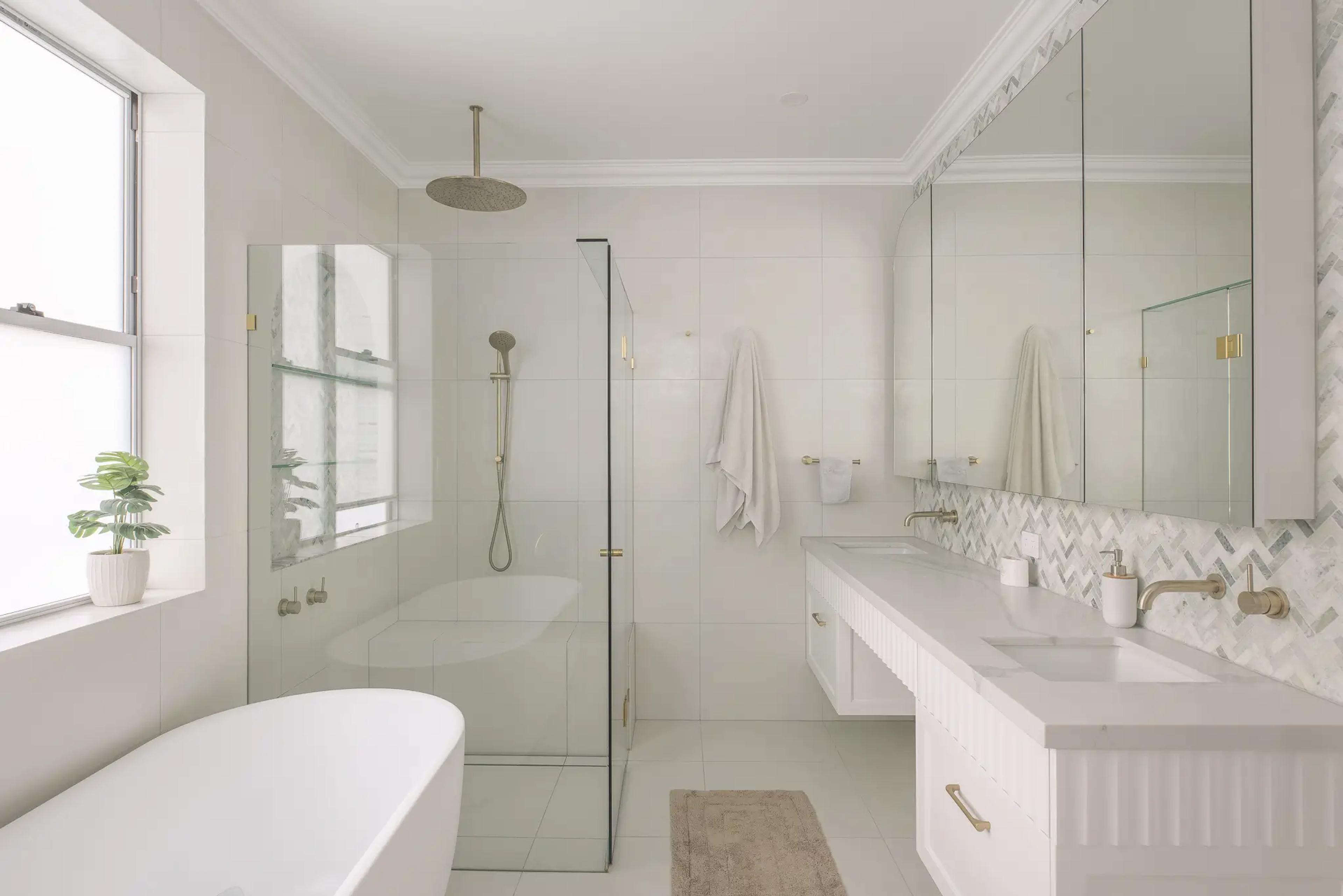 Bathroom with freestanding bath, walk in shower and double vanity