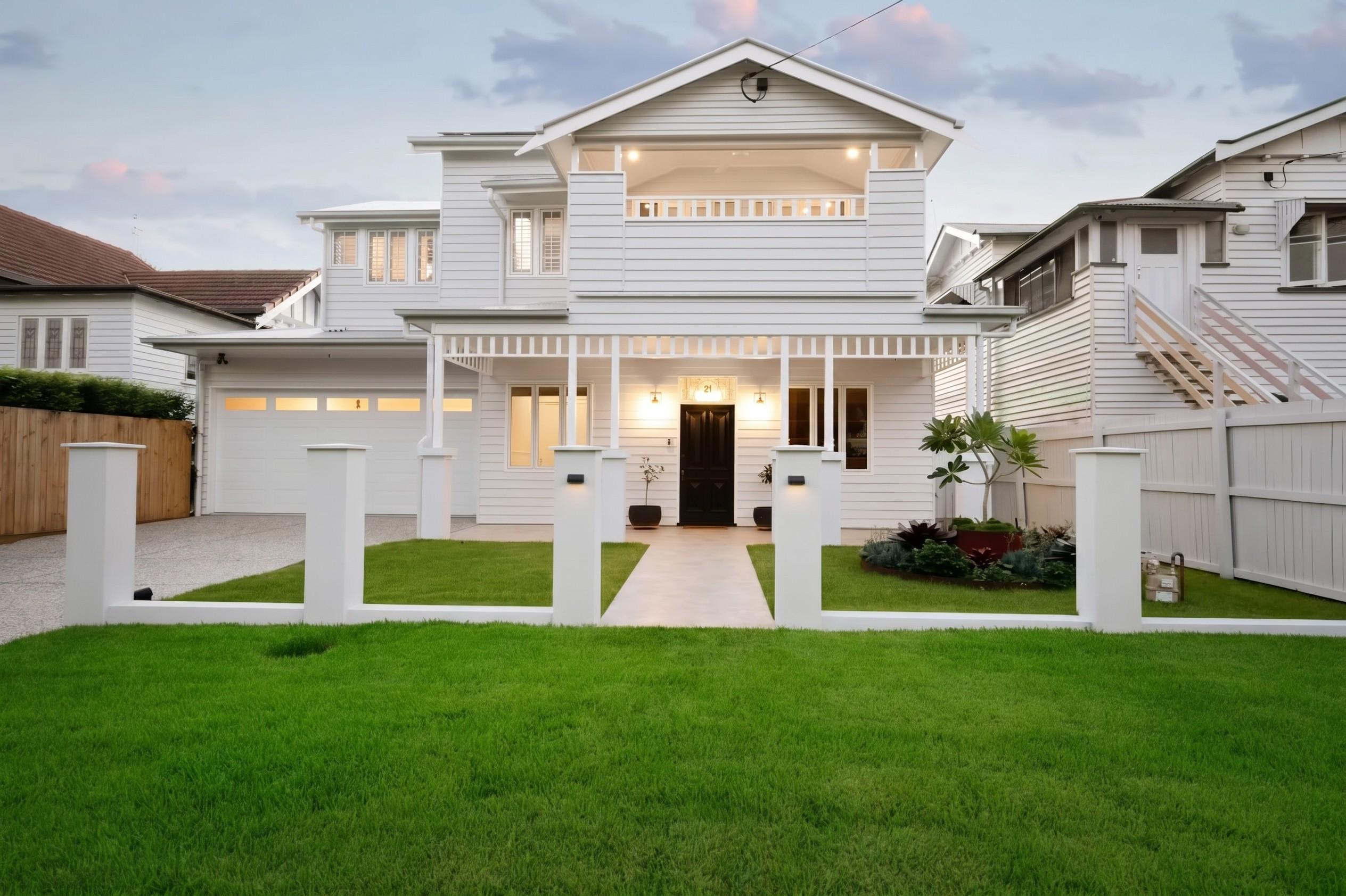 Front facade of two storey white weatherboard home
