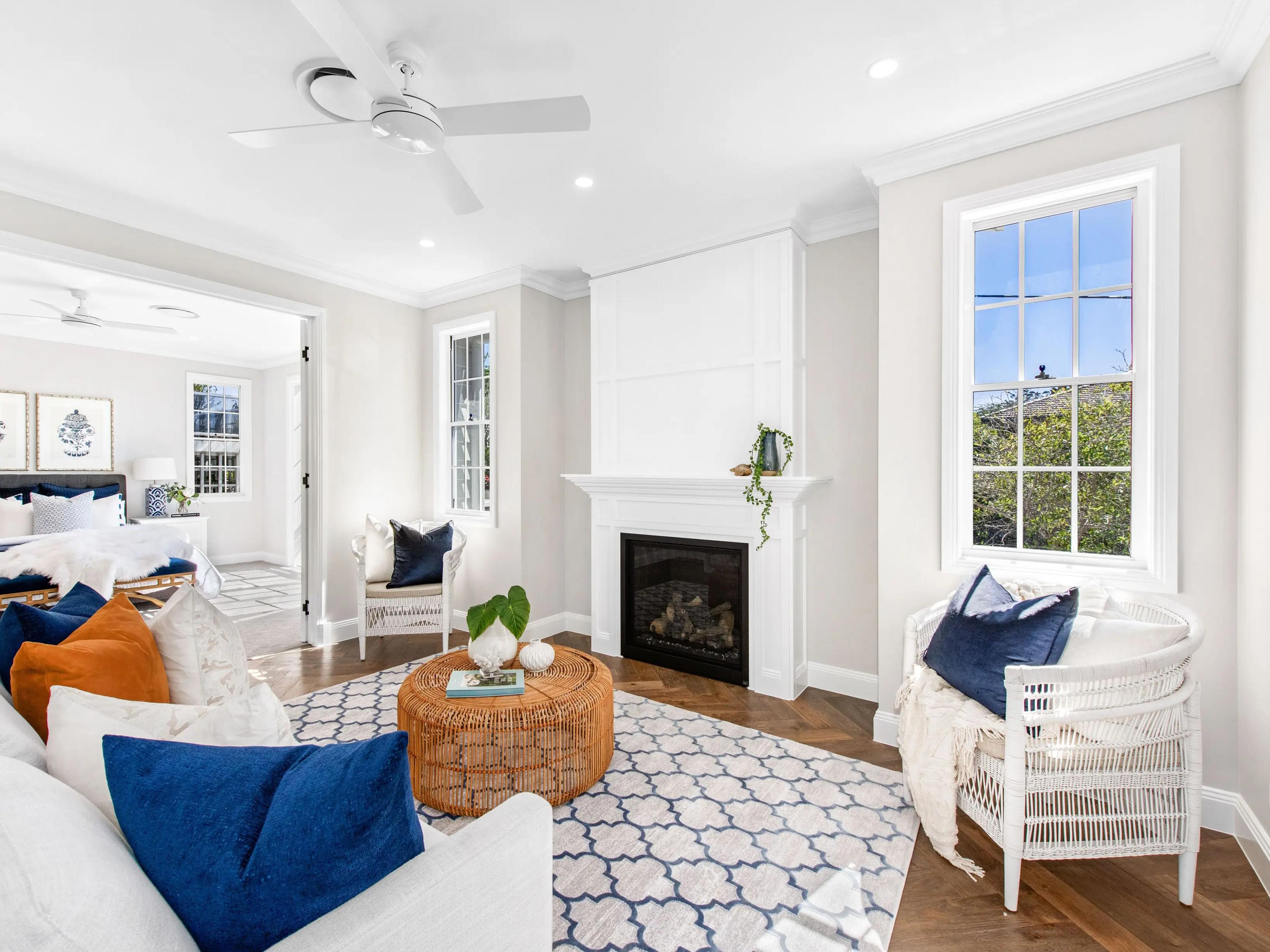 Sitting room with fireplace opening to a bedroom