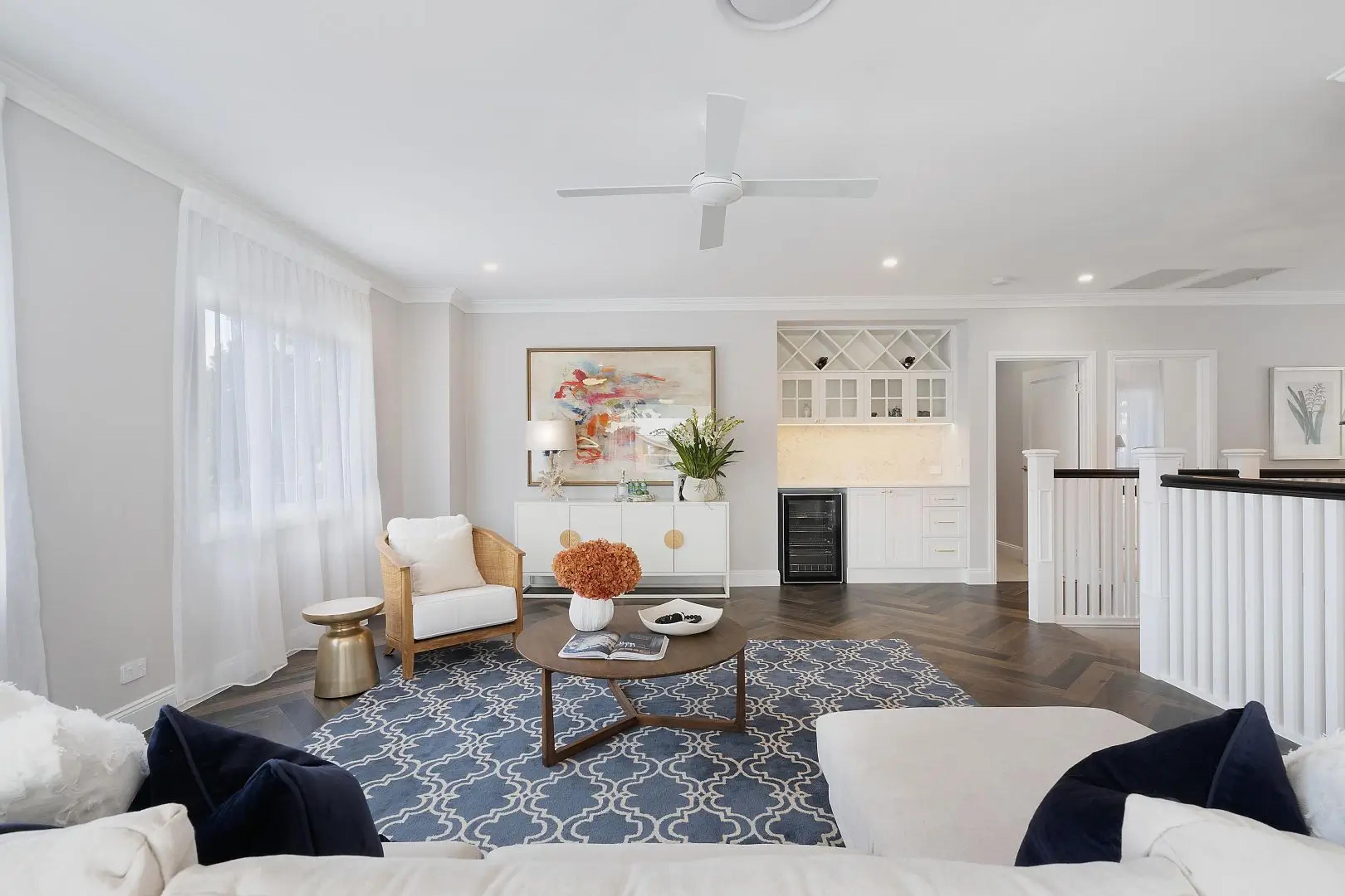 Upstairs lounge with wine bar and patterned blue rug