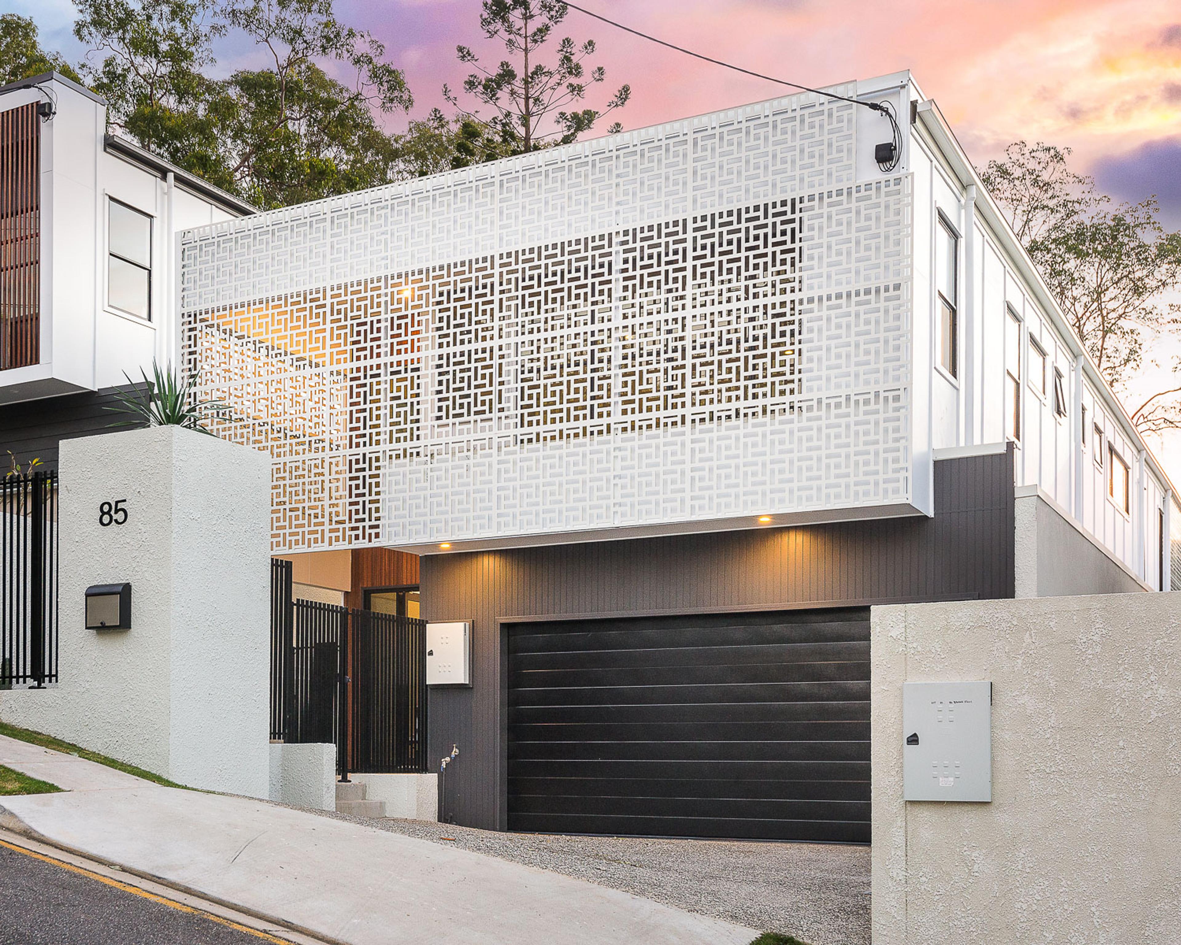 Upslope home with garage at street level and screened facade above, in Toowong, by Invilla Architecture