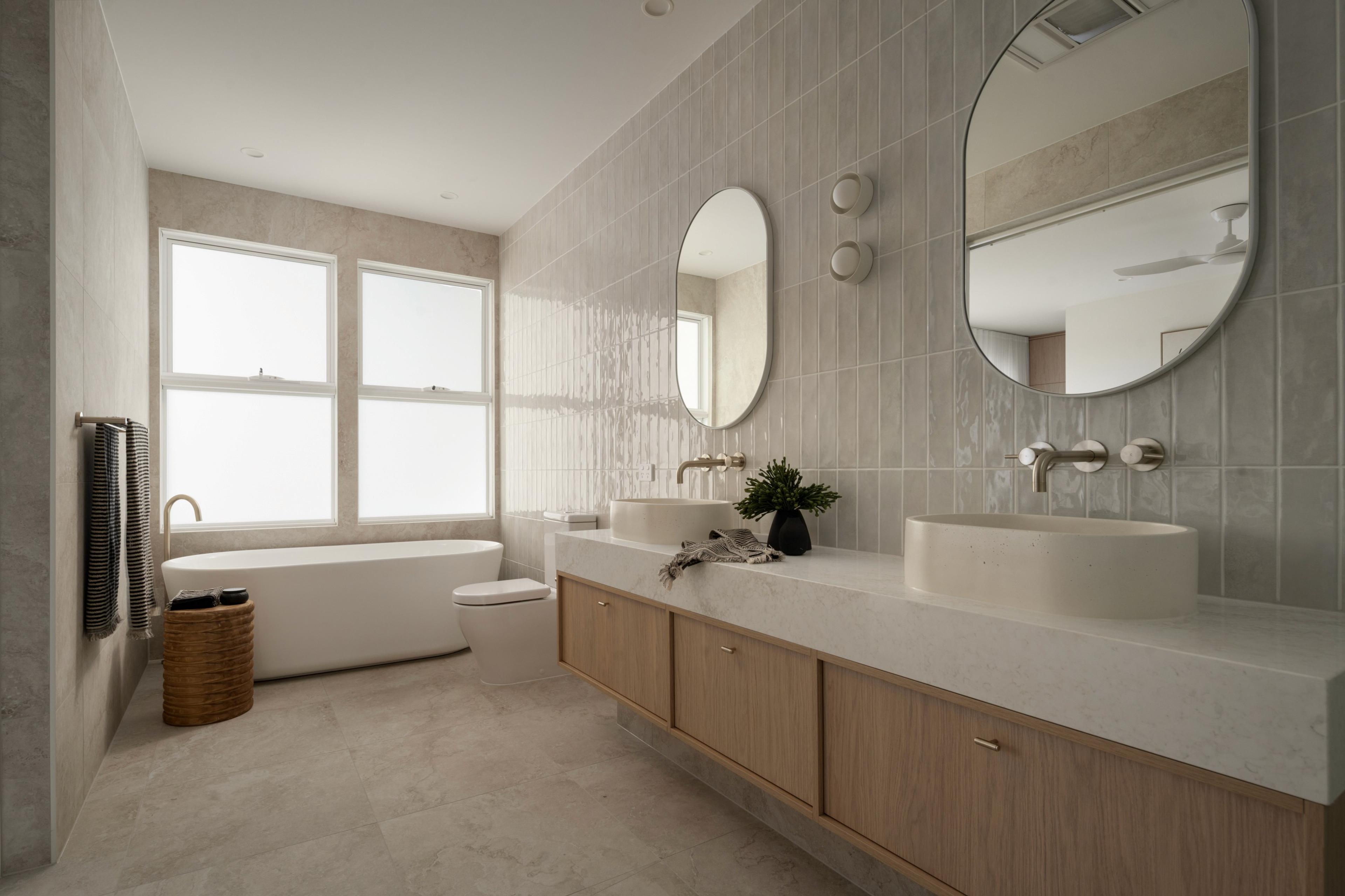 Bathroom with freestanding bath and double stone vanity