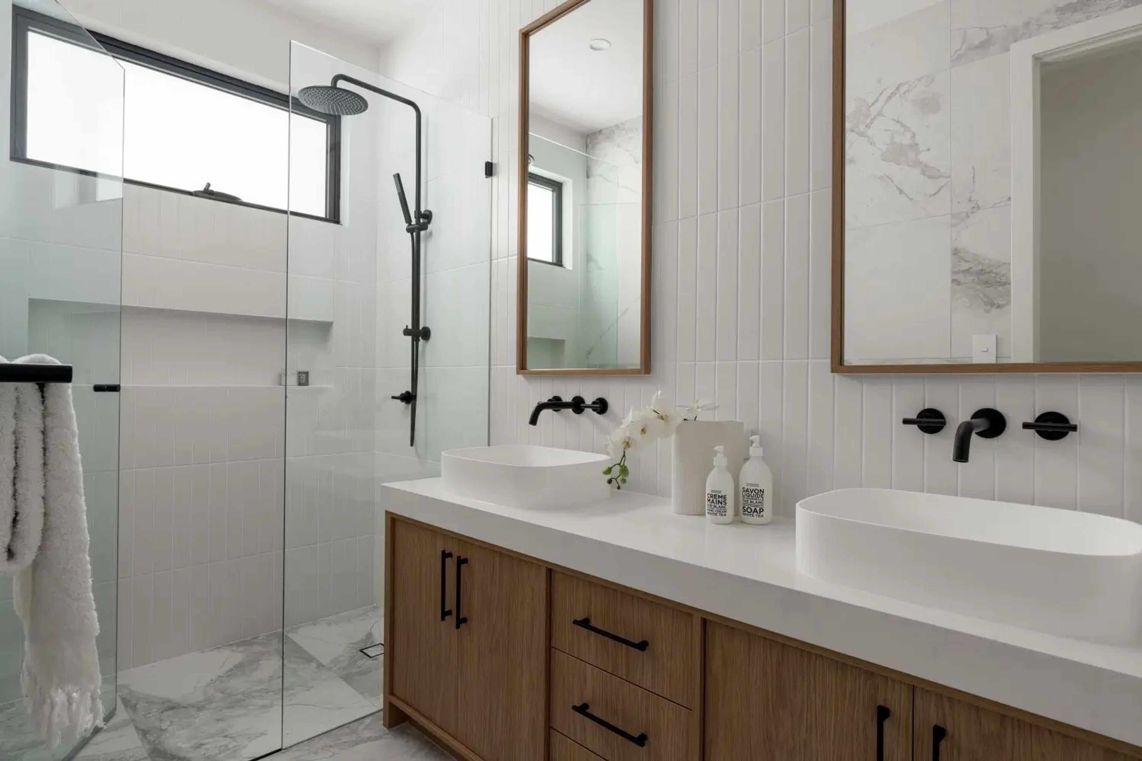 Bathroom with walk in shower and twin timber vanity