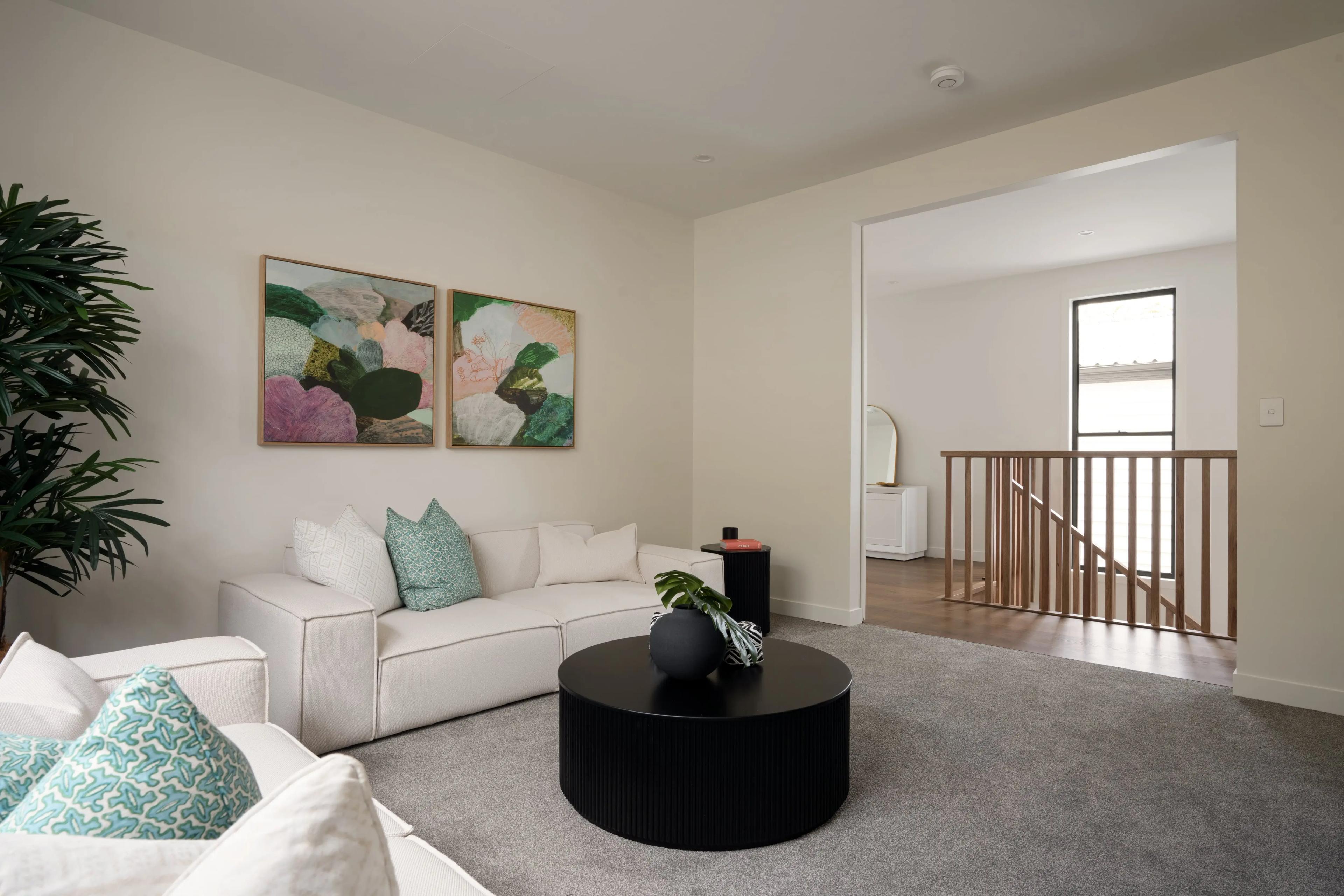 Upstairs living retreat with sofa and stair void