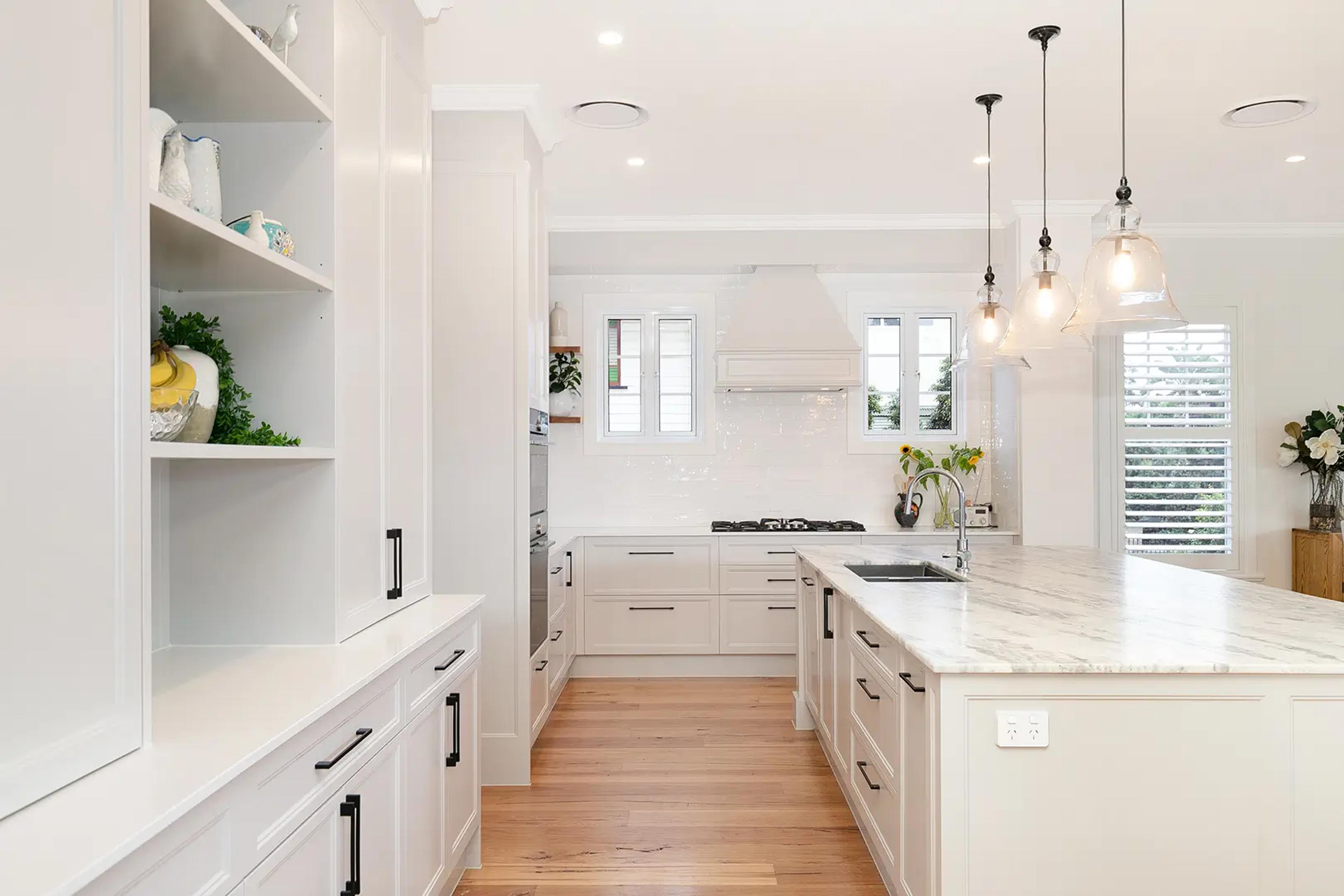 Kitchen with marble benchtops and open shelving