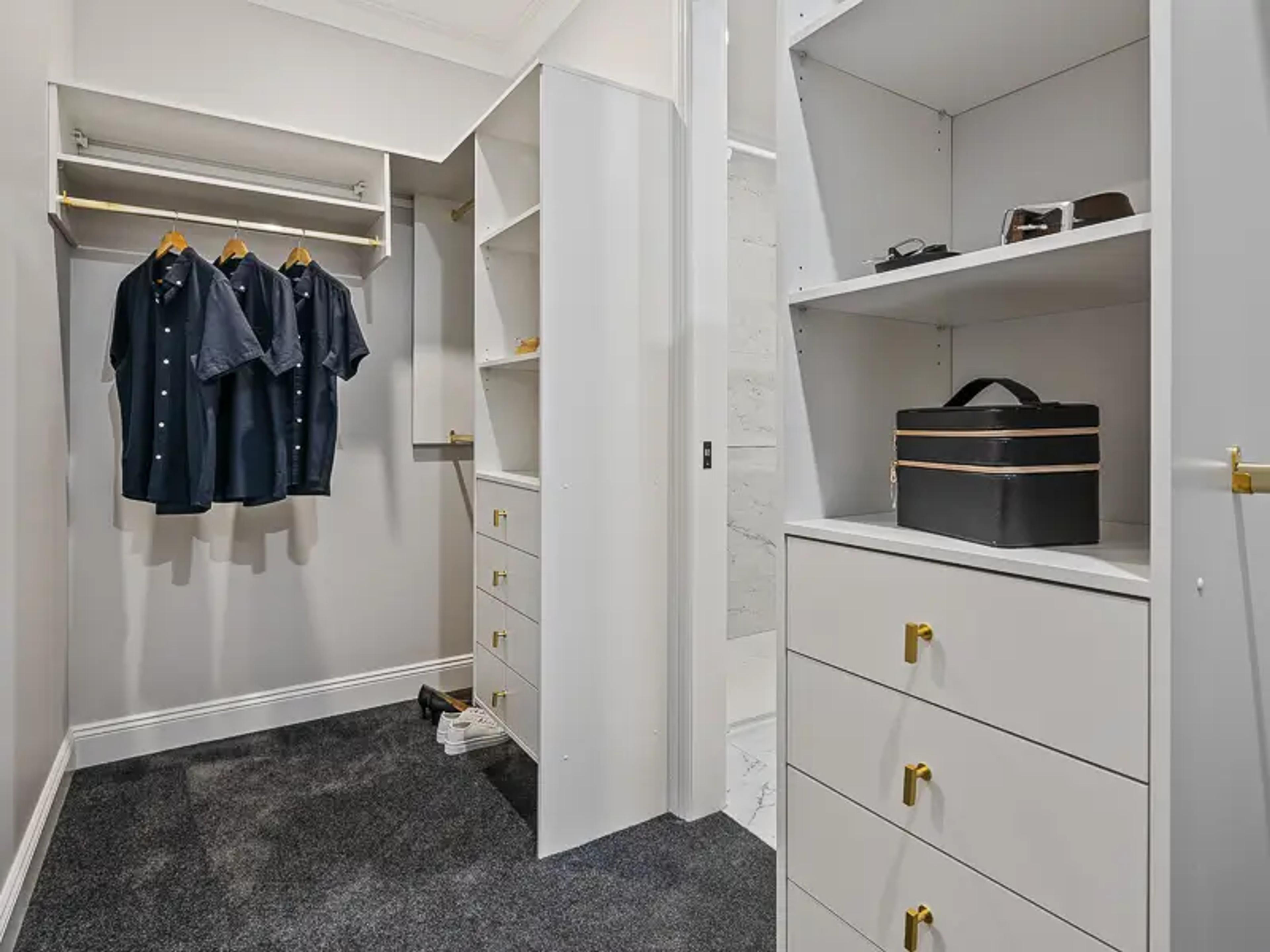 Walk in wardrobe with hanging space, shelving and drawers