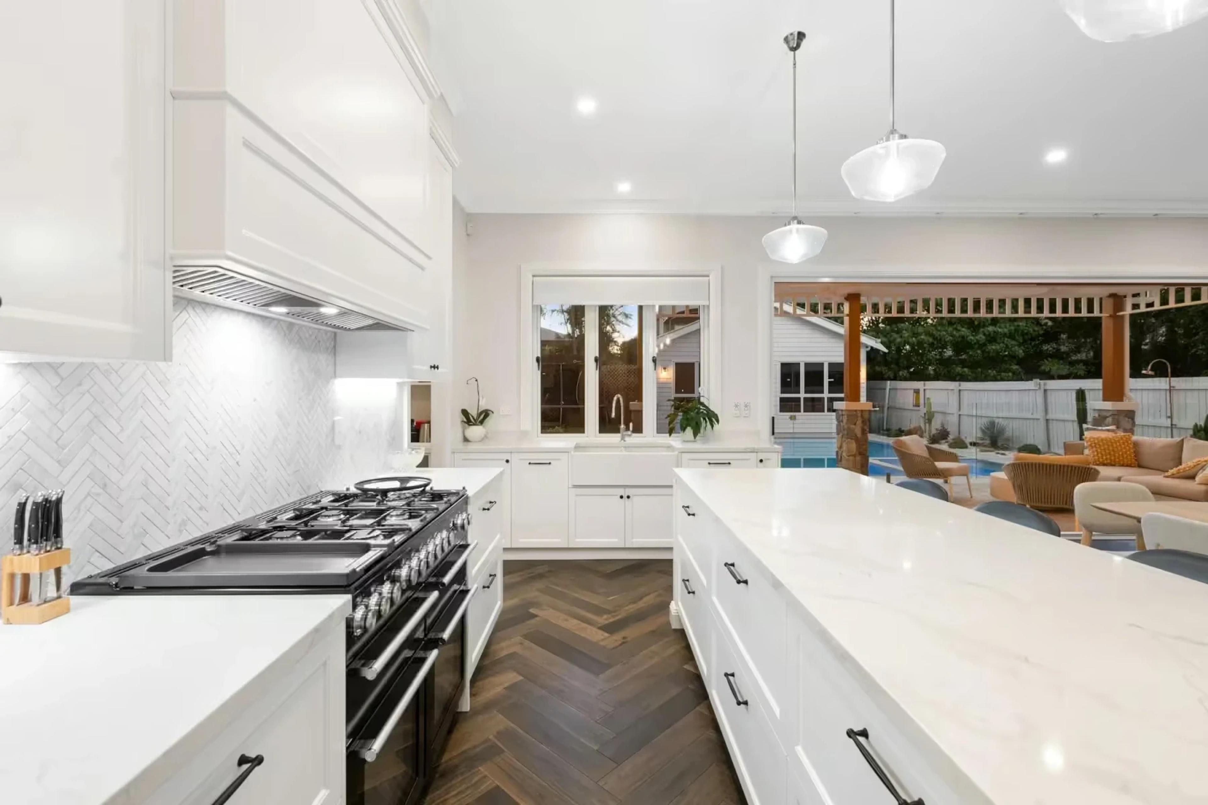 Kitchen with black range cooker and marble island