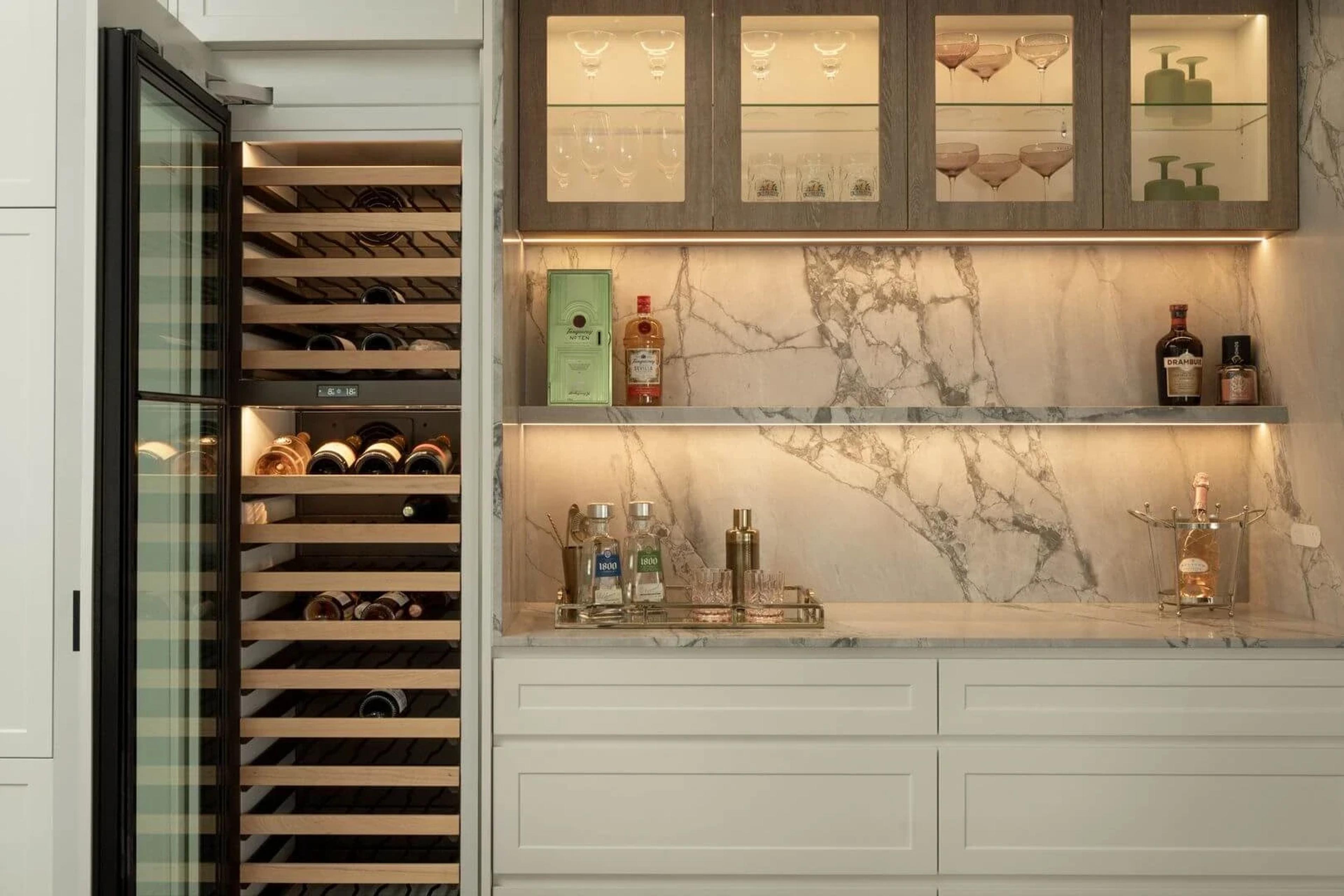 Butler's pantry with marble splashback and glass fronted wine fridge