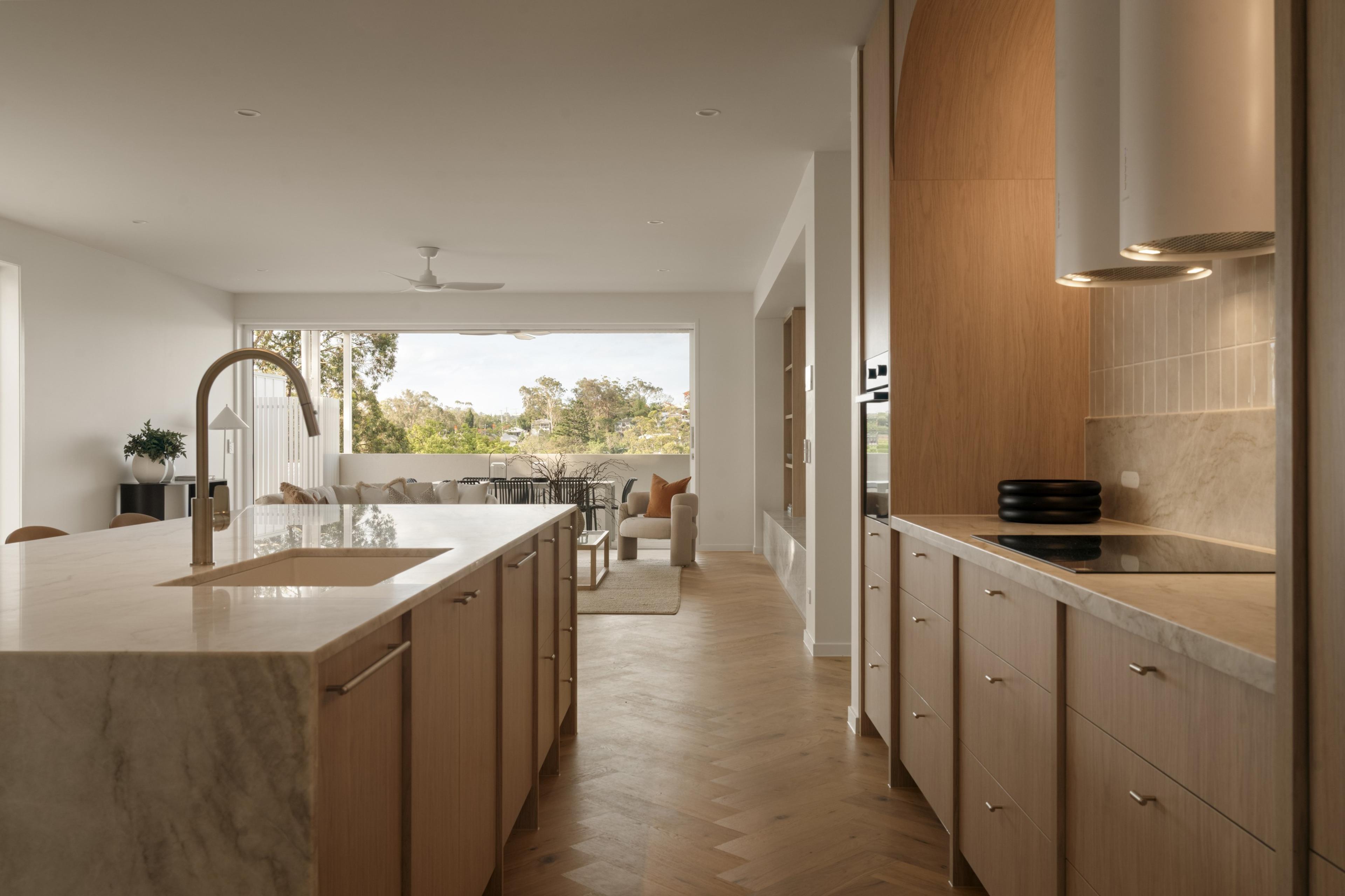 Kitchen with stone island and timber cabinetry