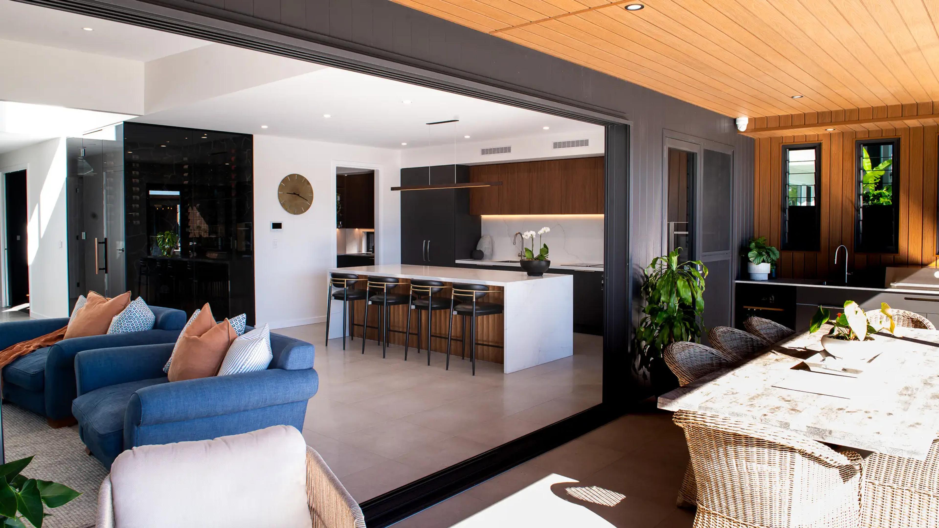 Open plan kitchen and living area with timber ceiling