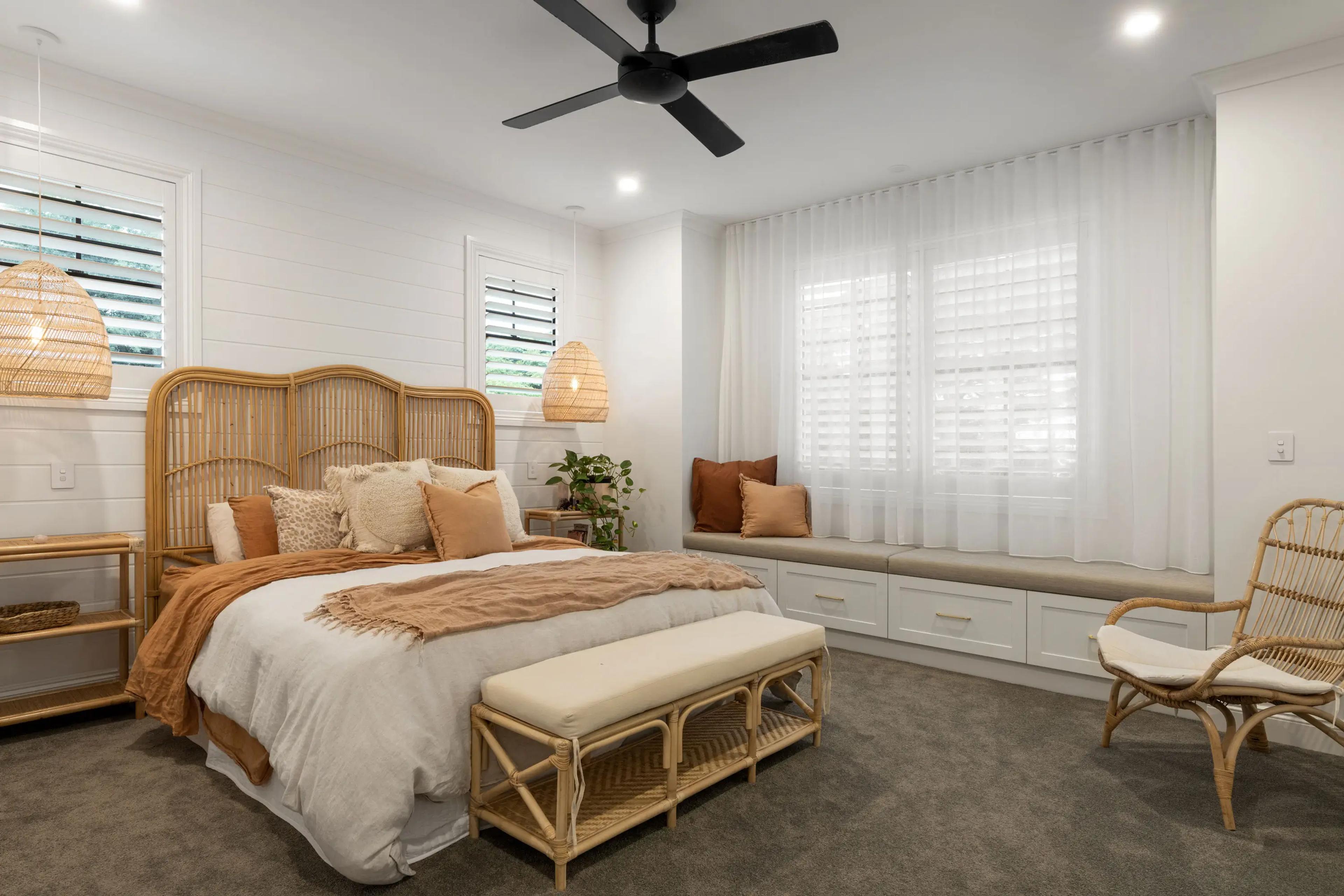 Main bedroom with rattan bed head and cushioned window seat