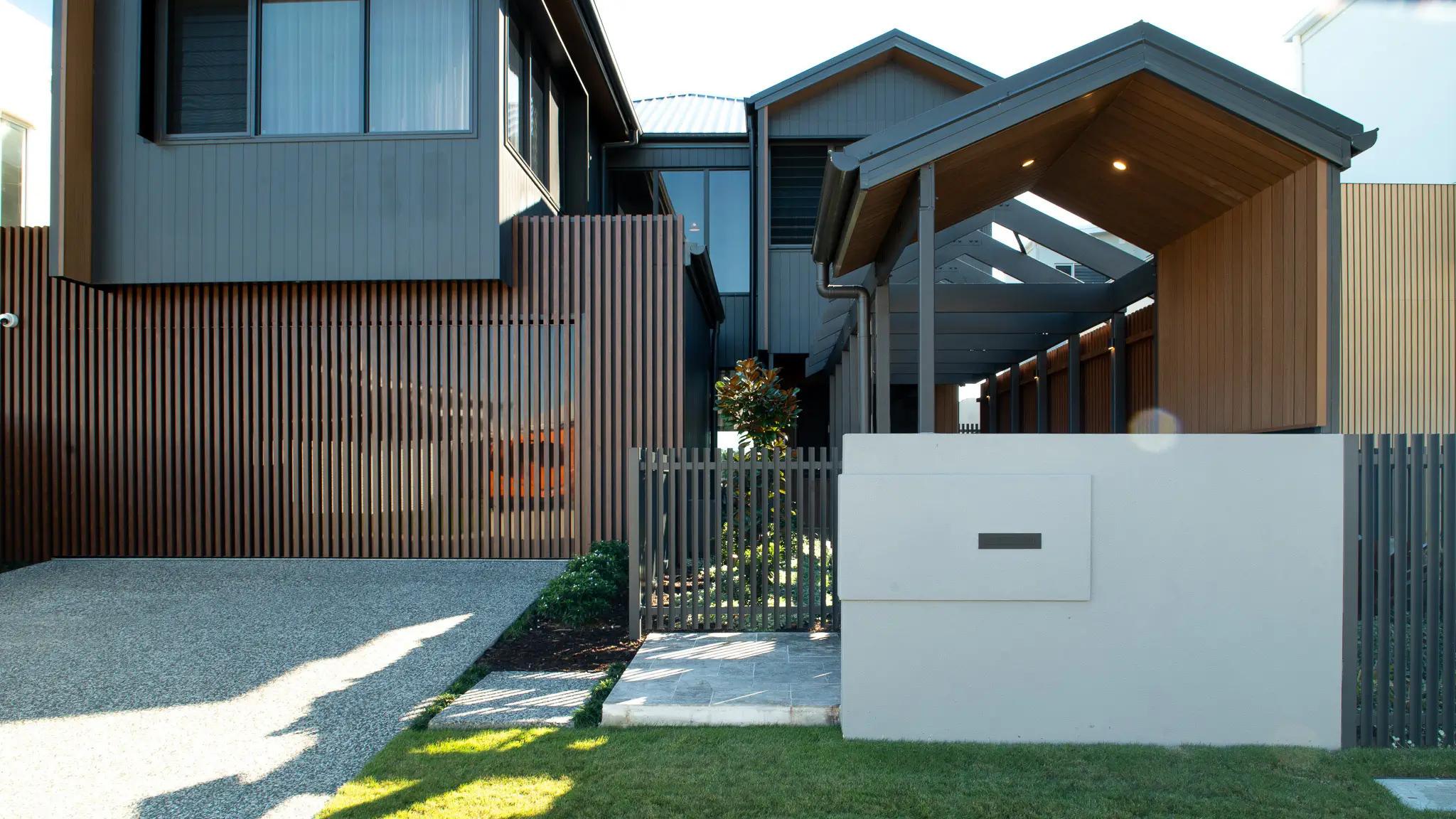 Street facing home entry with timber screens and letterbox