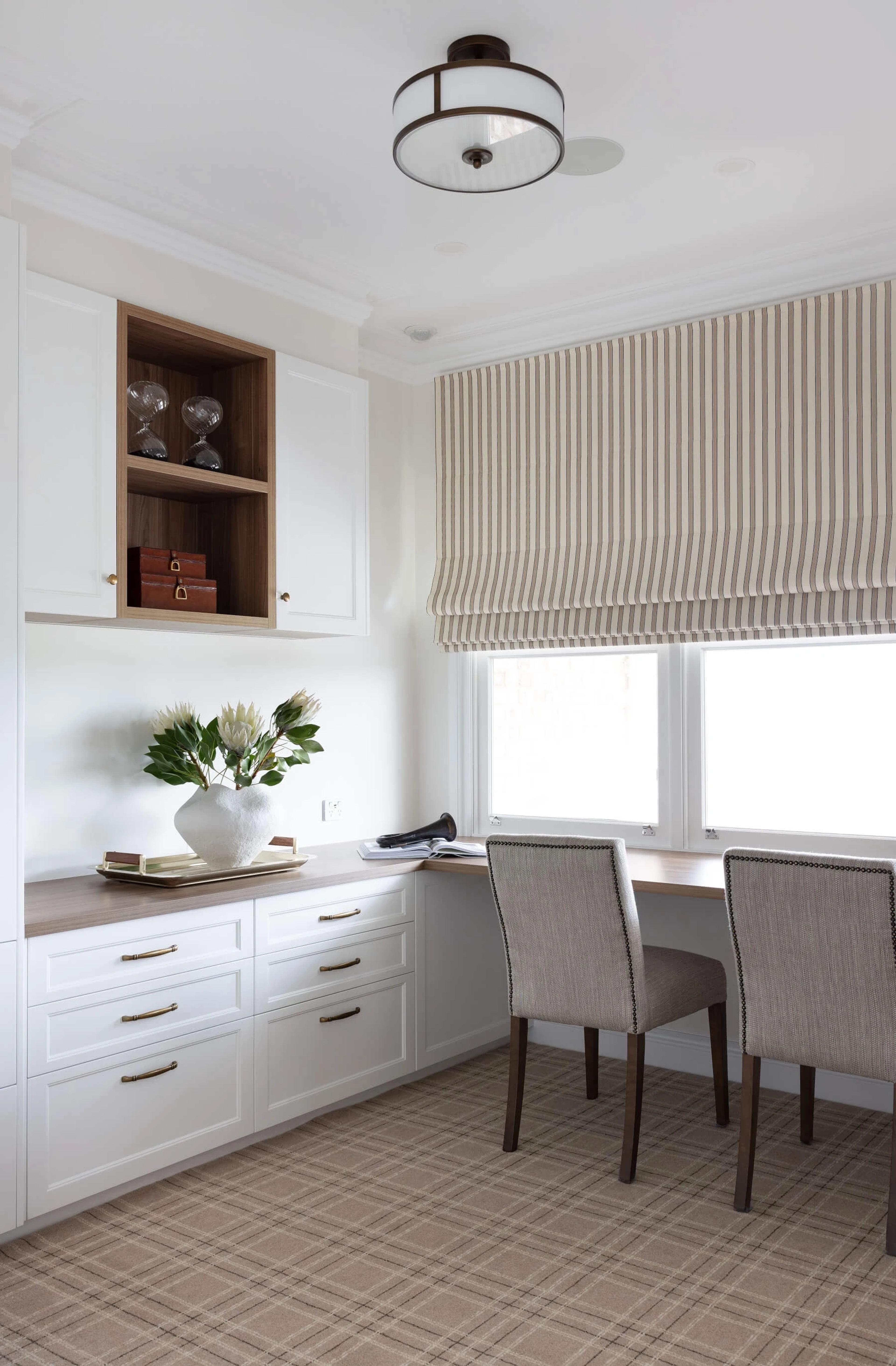 Home study with built in desk and cabinetry