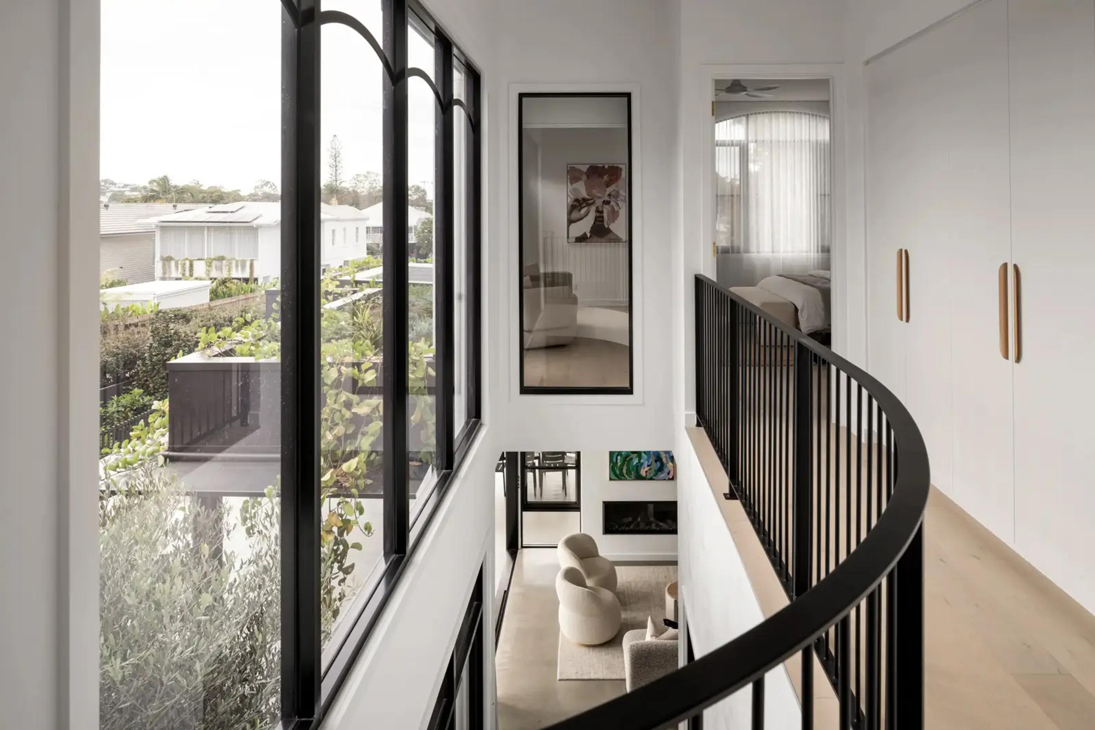 Upstairs landing with arched windows overlooking the street