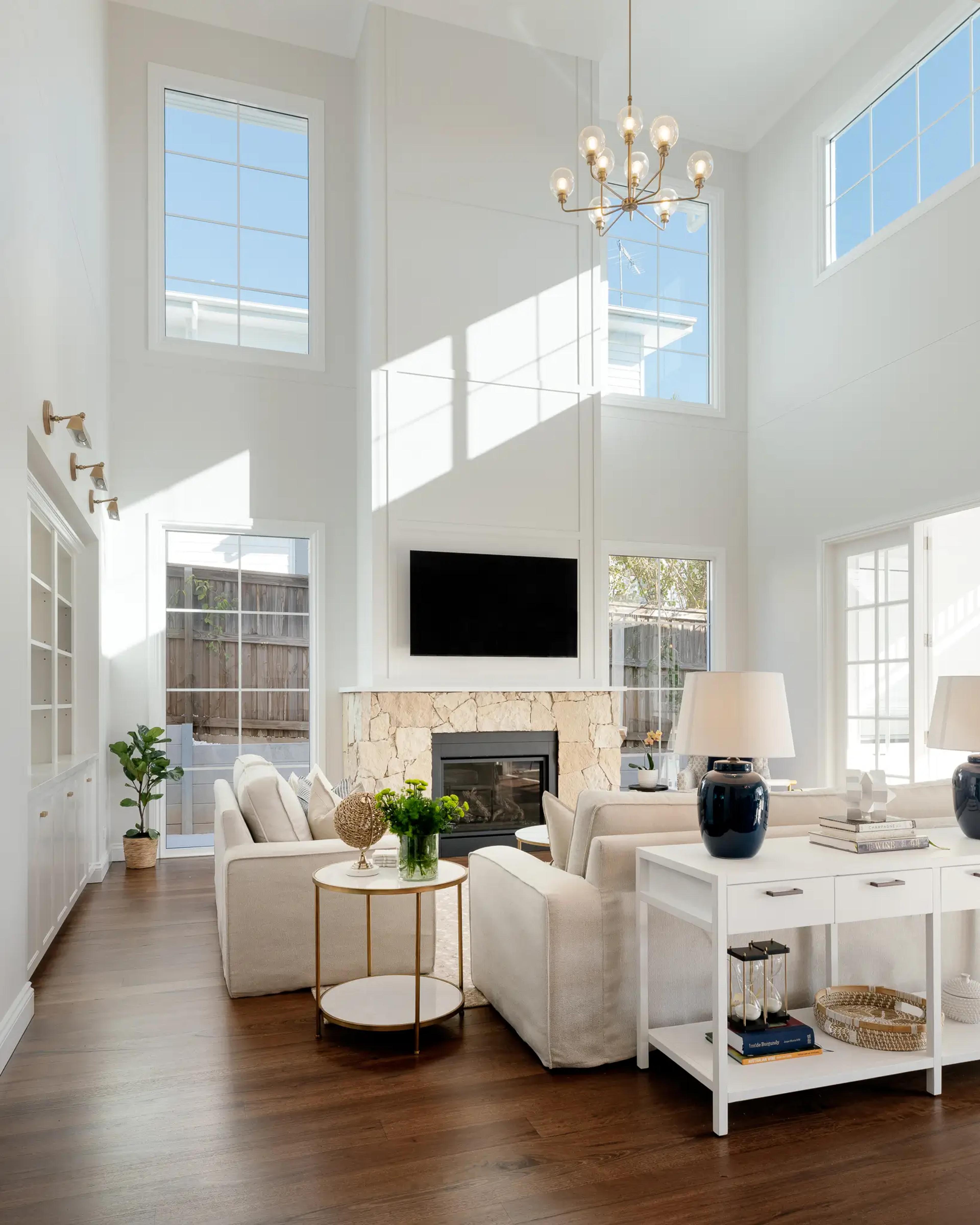 Modern architectural living space showcasing the value of high, clerestory windows to maximise natural light and create an open, airy atmosphere.