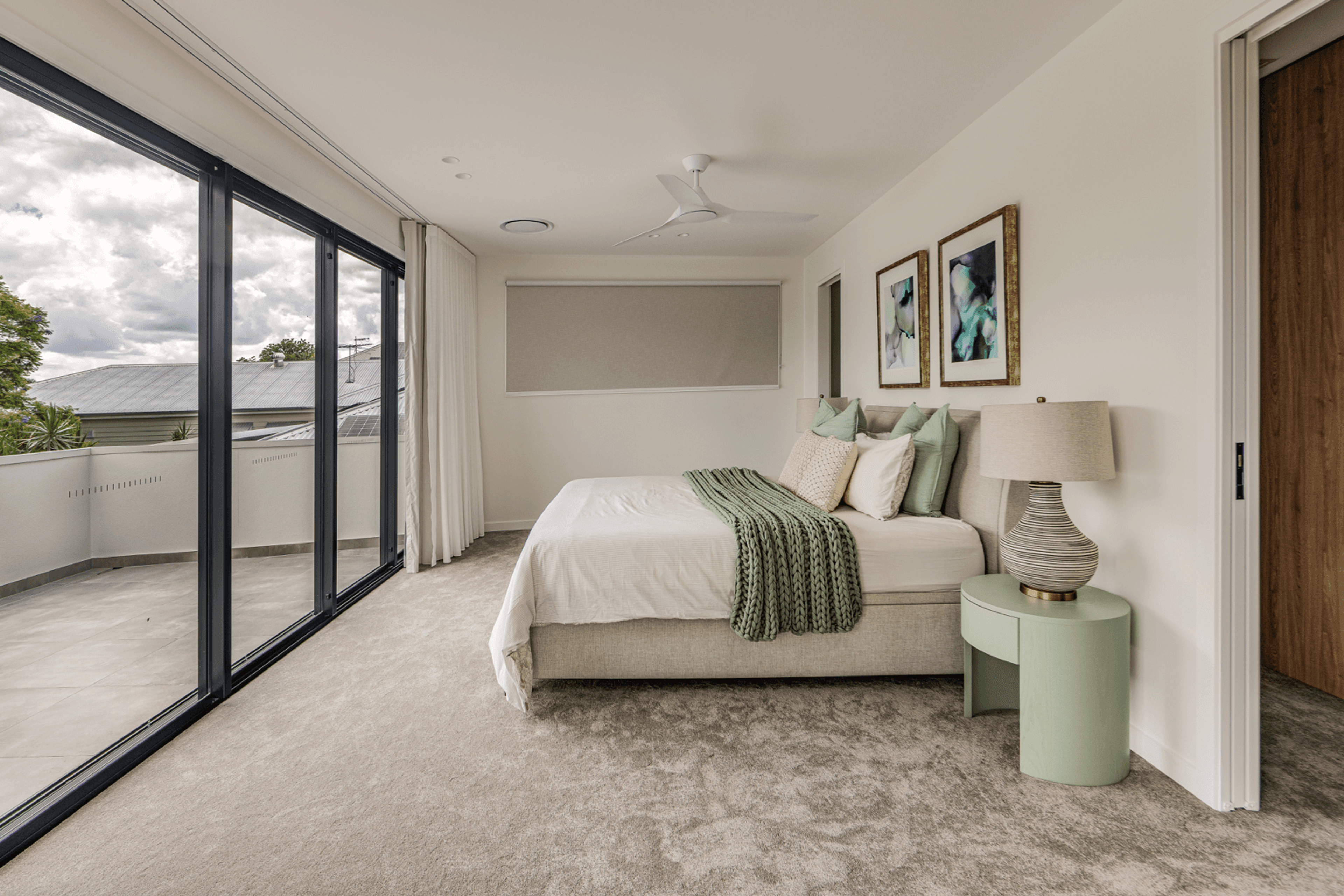 Bedroom with sliding doors opening to a balcony
