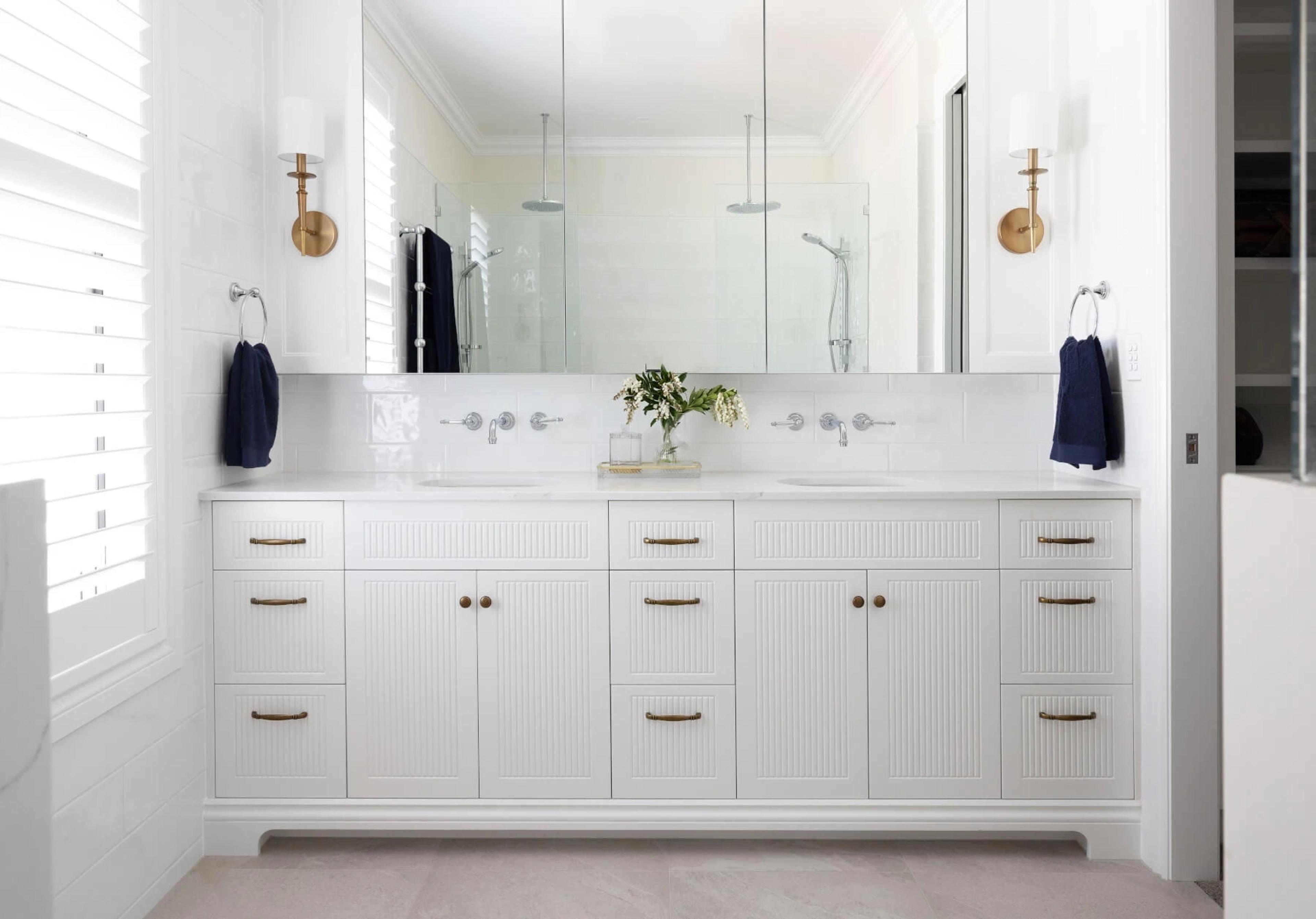 Bathroom with double vanity and large mirror