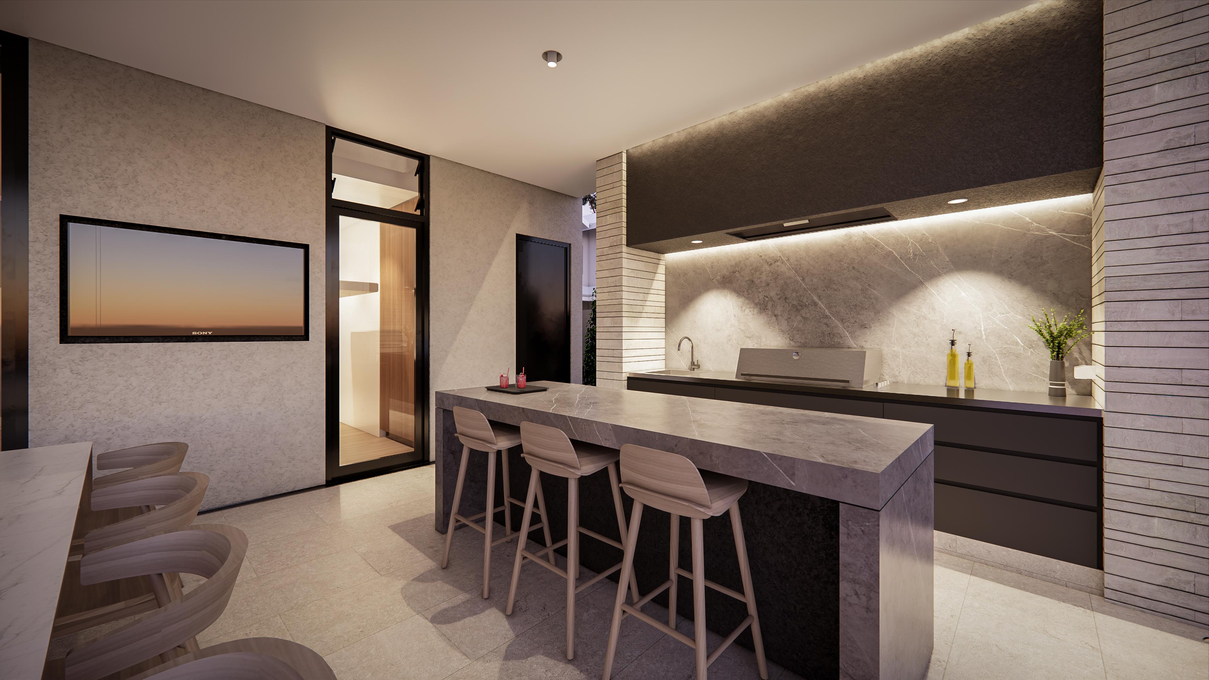 Alfresco kitchen bar at dusk with warm strip lighting, television and stone benchtop glowing softly