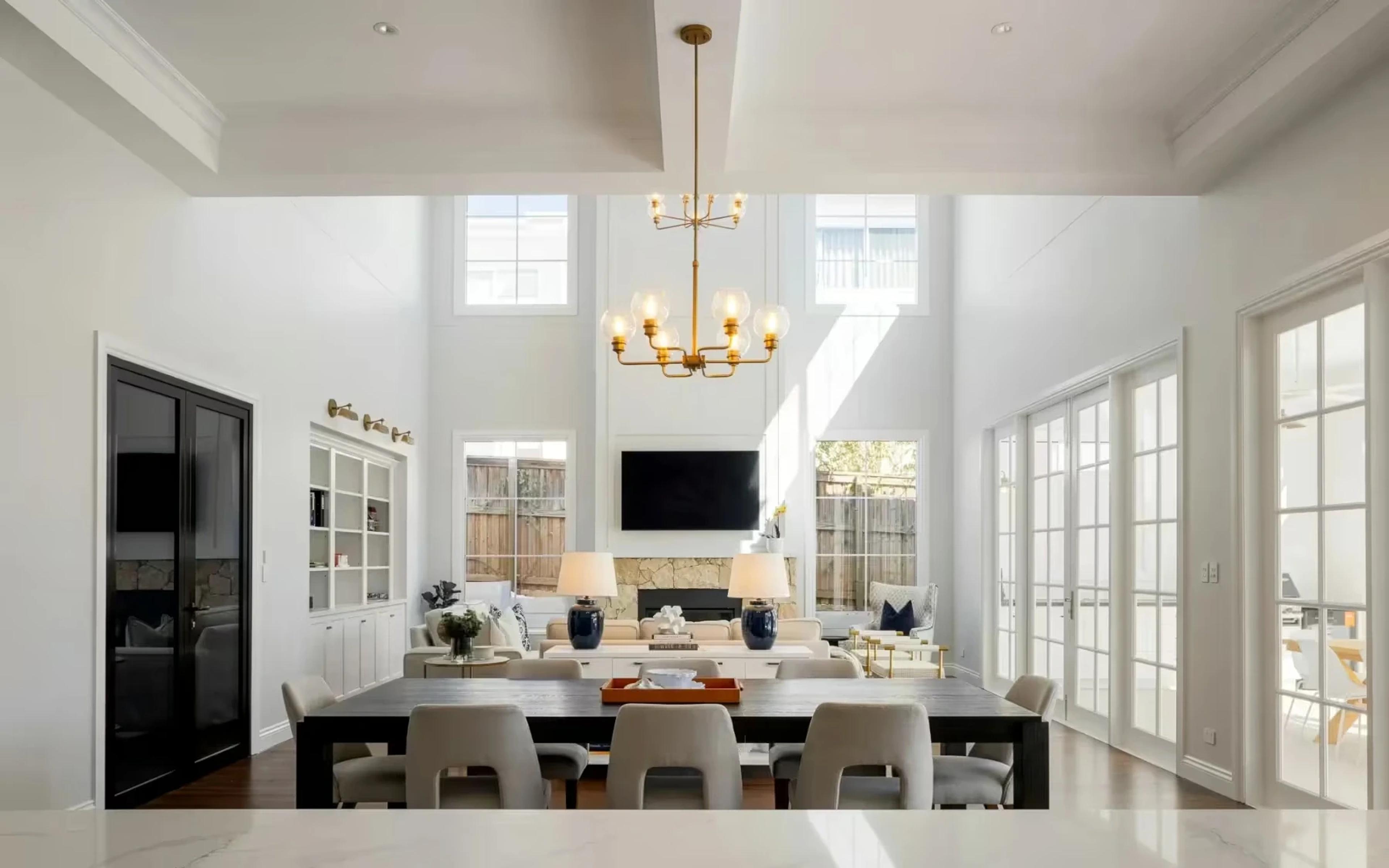 Open plan dining and living area with high ceilings