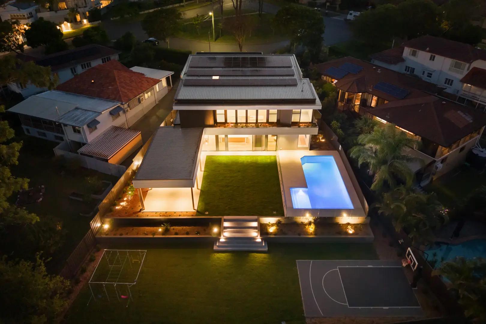 Luxury modern custom home design in Brisbane by Invilla Architecture, featuring expansive glass, seamless indoor-outdoor living, and architectural lighting.