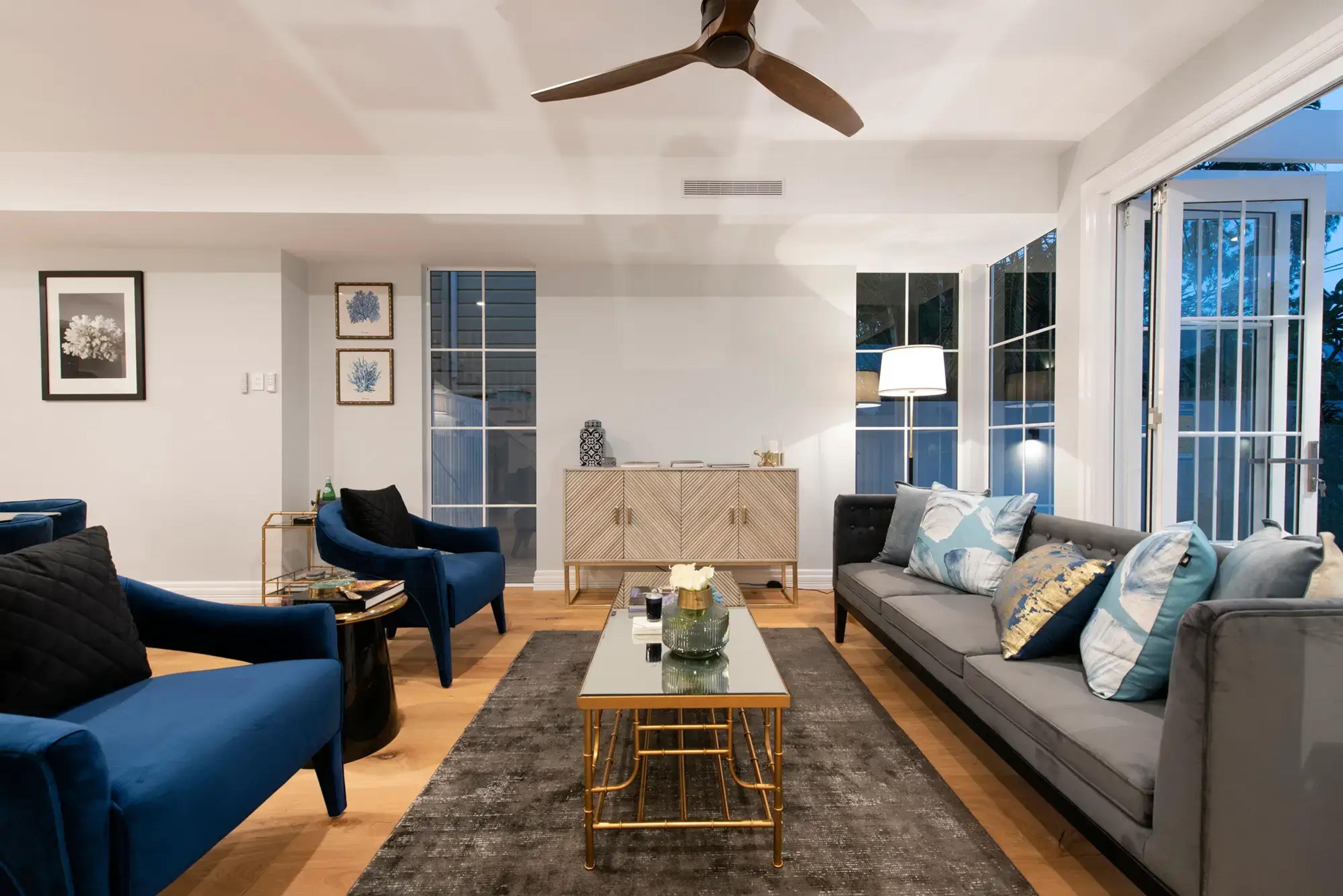 Living room with sofas and French doors to garden