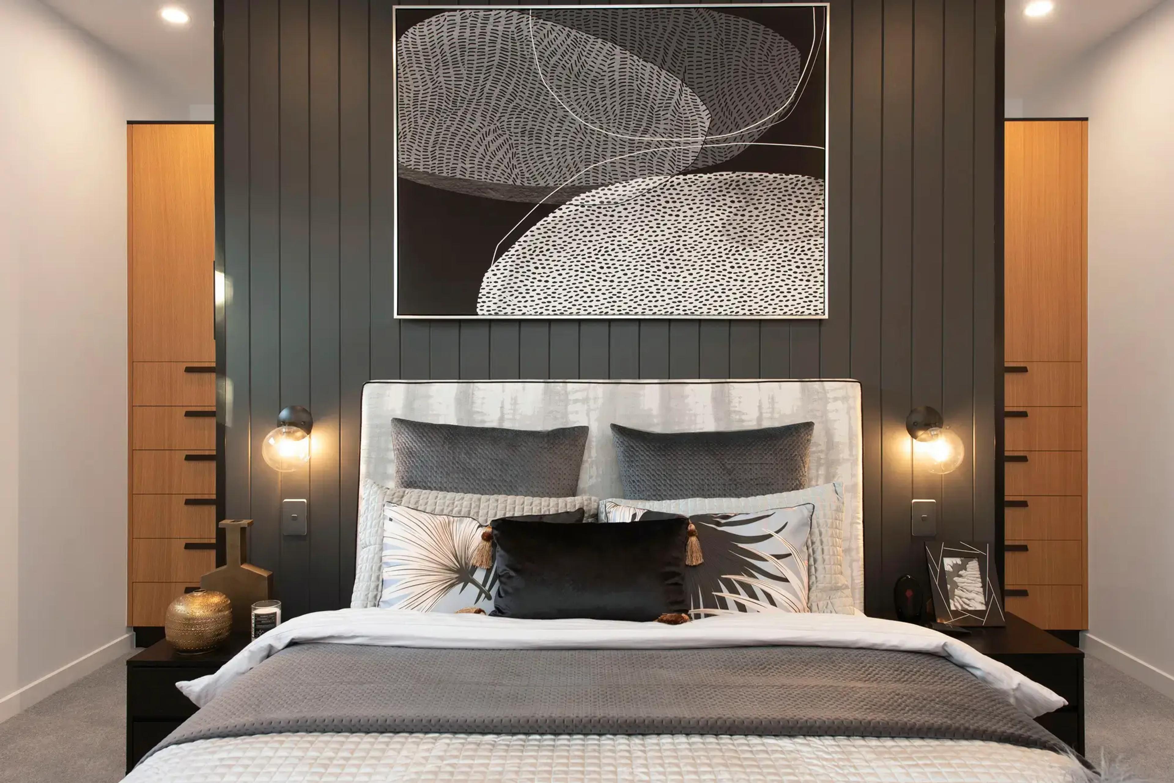 Bedroom with timber joinery and dark feature wall