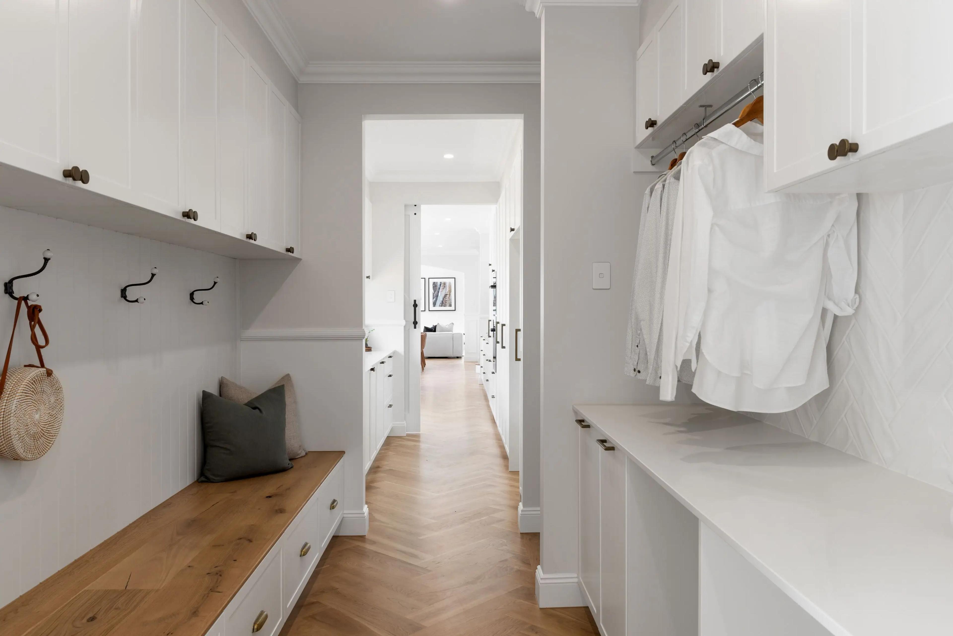 Mudroom with timber bench seat, coat hooks and hanging storage