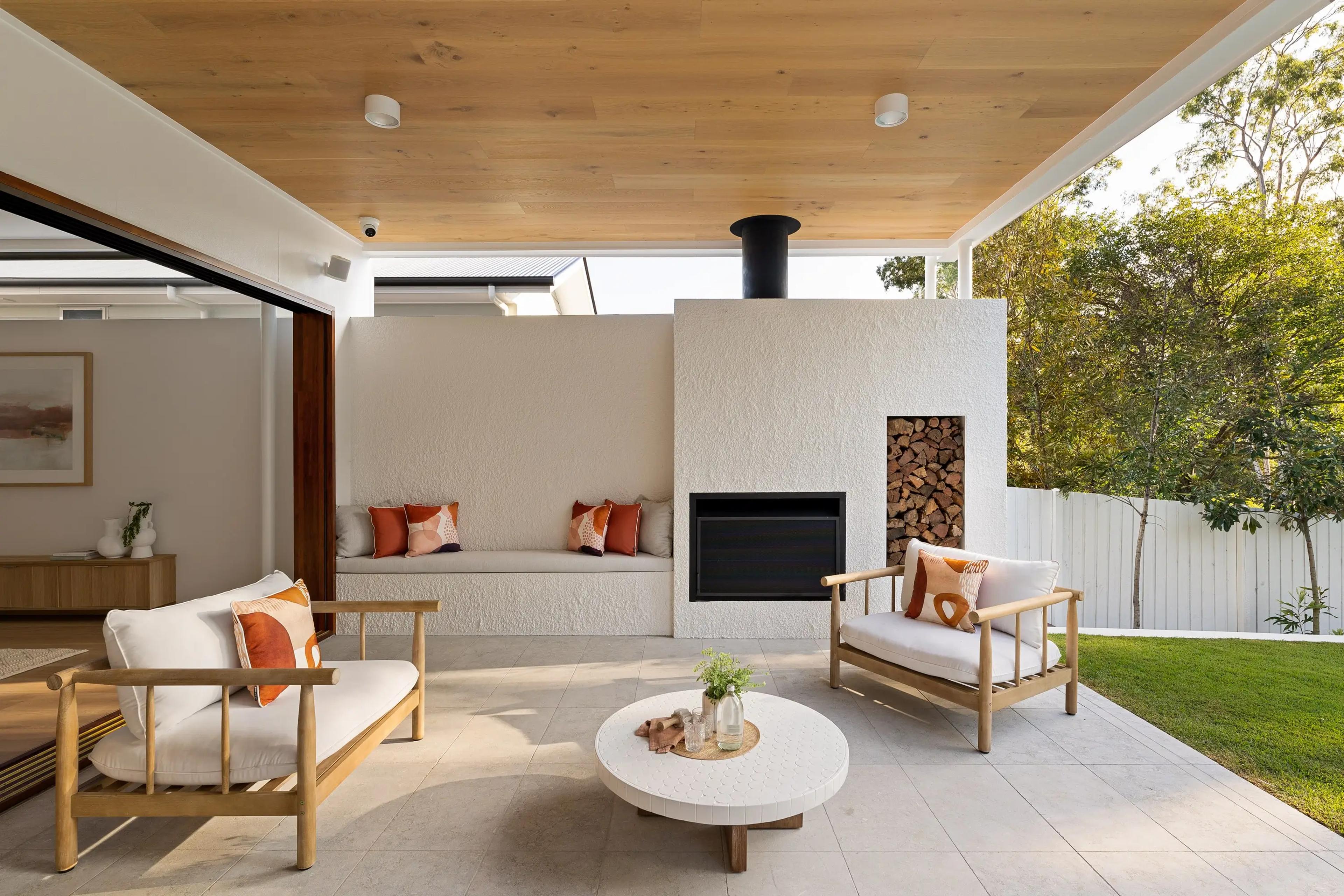 Outdoor lounge with rendered fireplace and built in bench seat