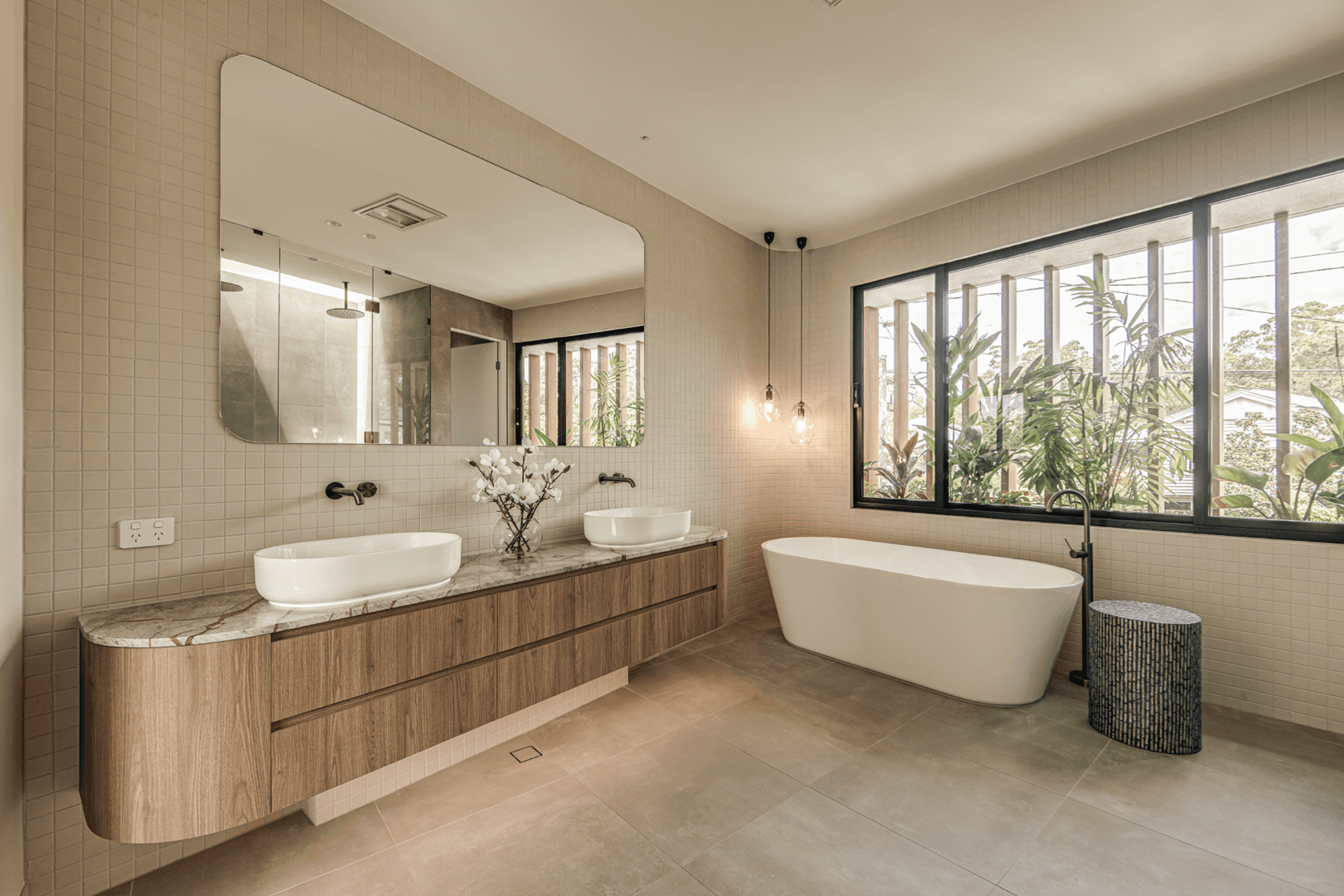 Bathroom with double basins, timber vanity and freestanding bath