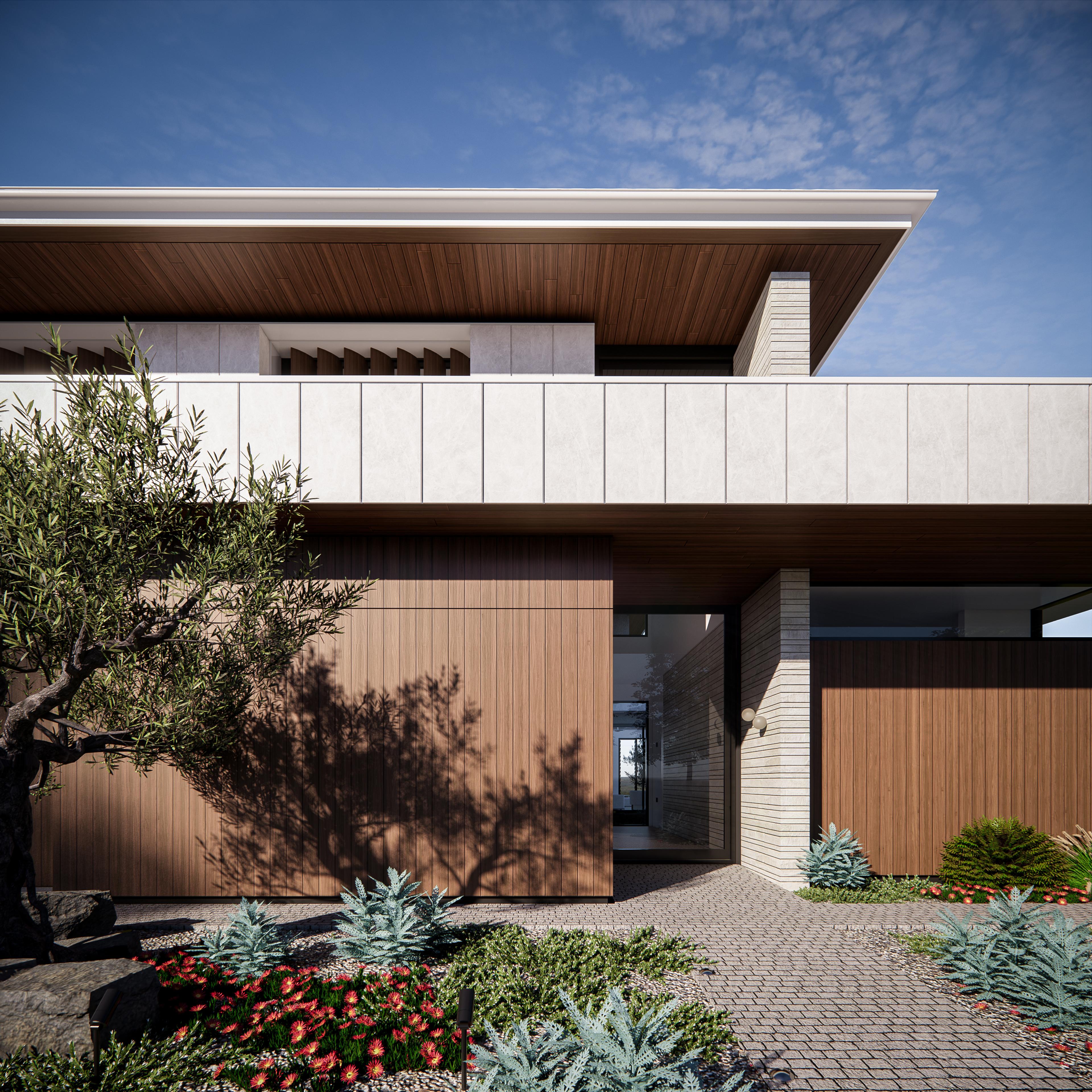 Close view of the timber front entry and pivot door framed by a white brick pier and layered planting