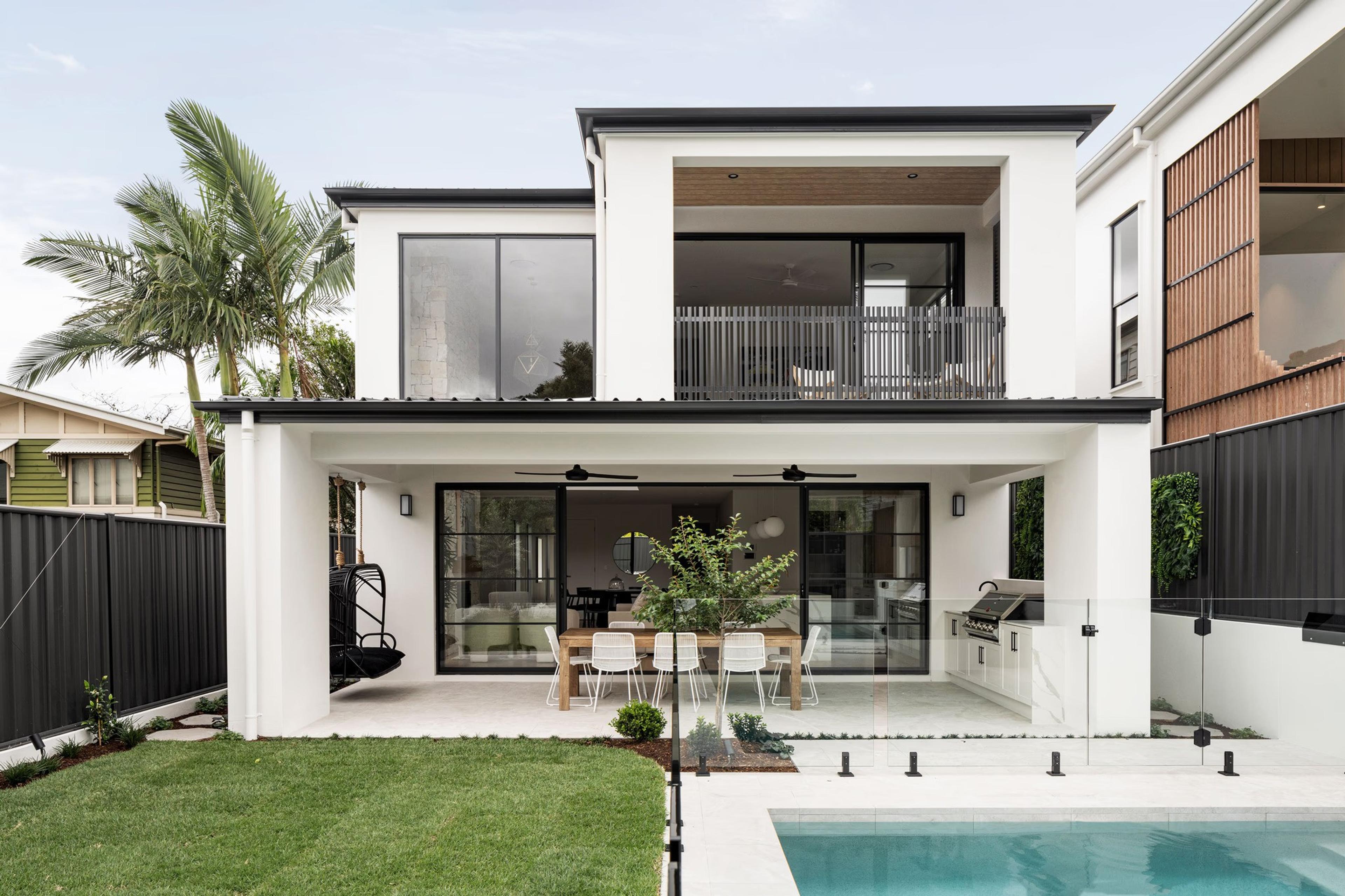 Rear facade with covered alfresco terrace and pool