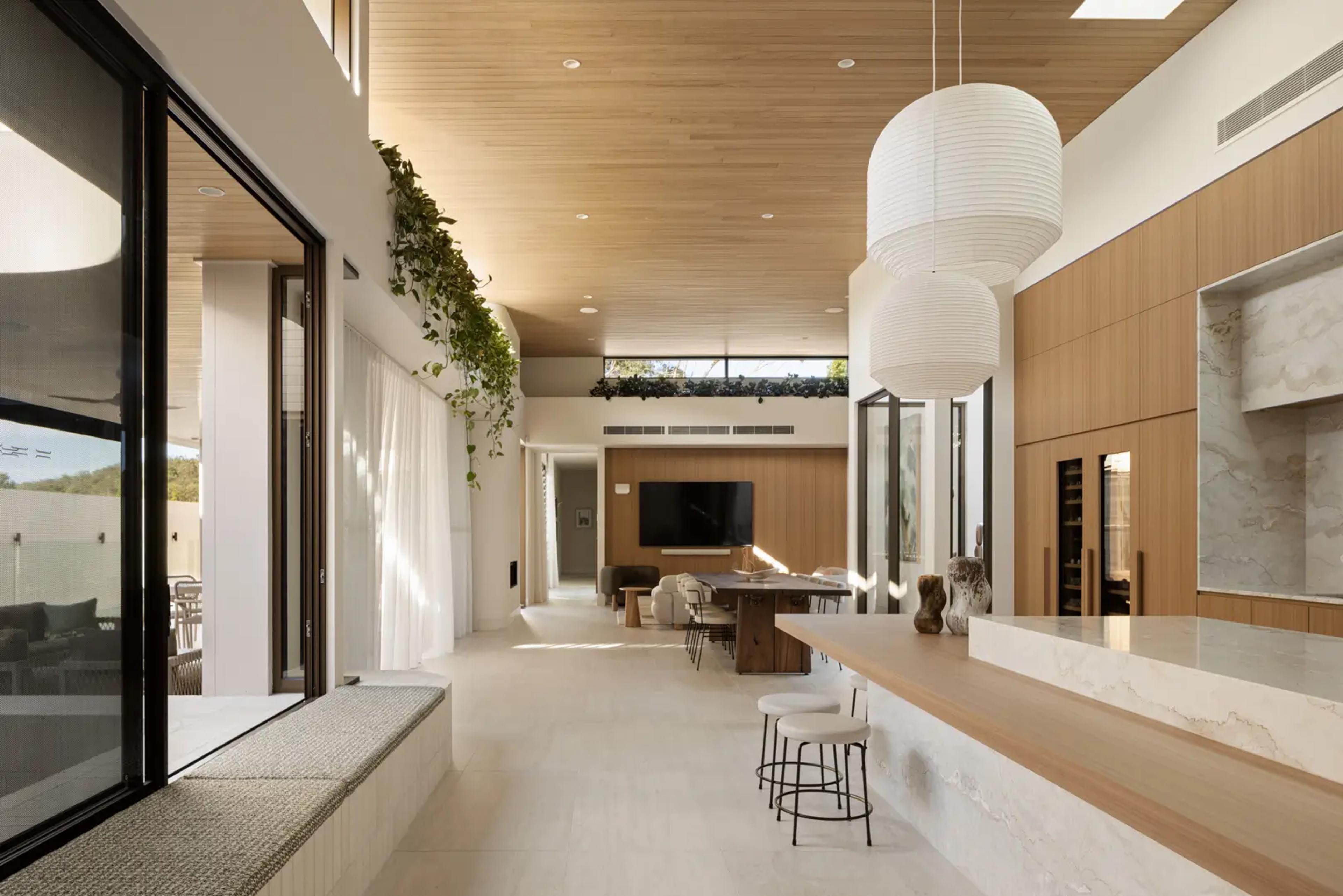 Open kitchen and living area with paper lantern pendants