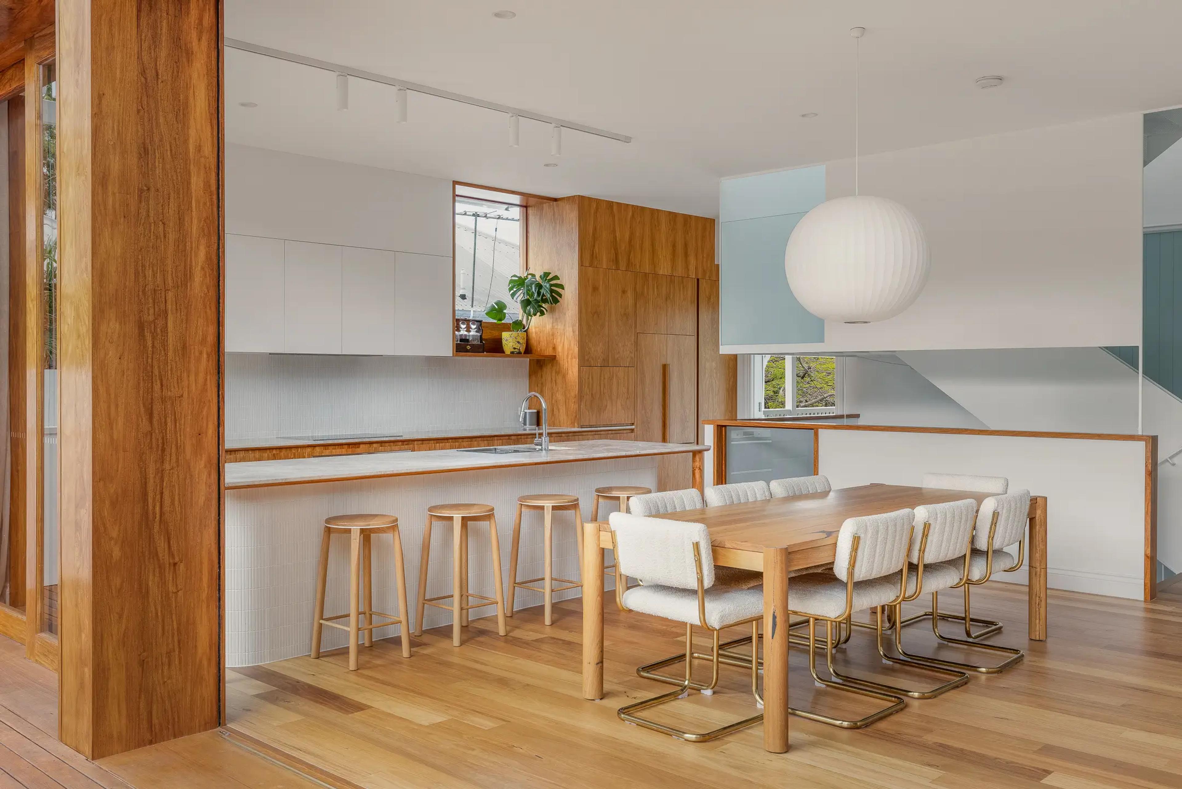 Open plan timber kitchen and dining area with island bench
