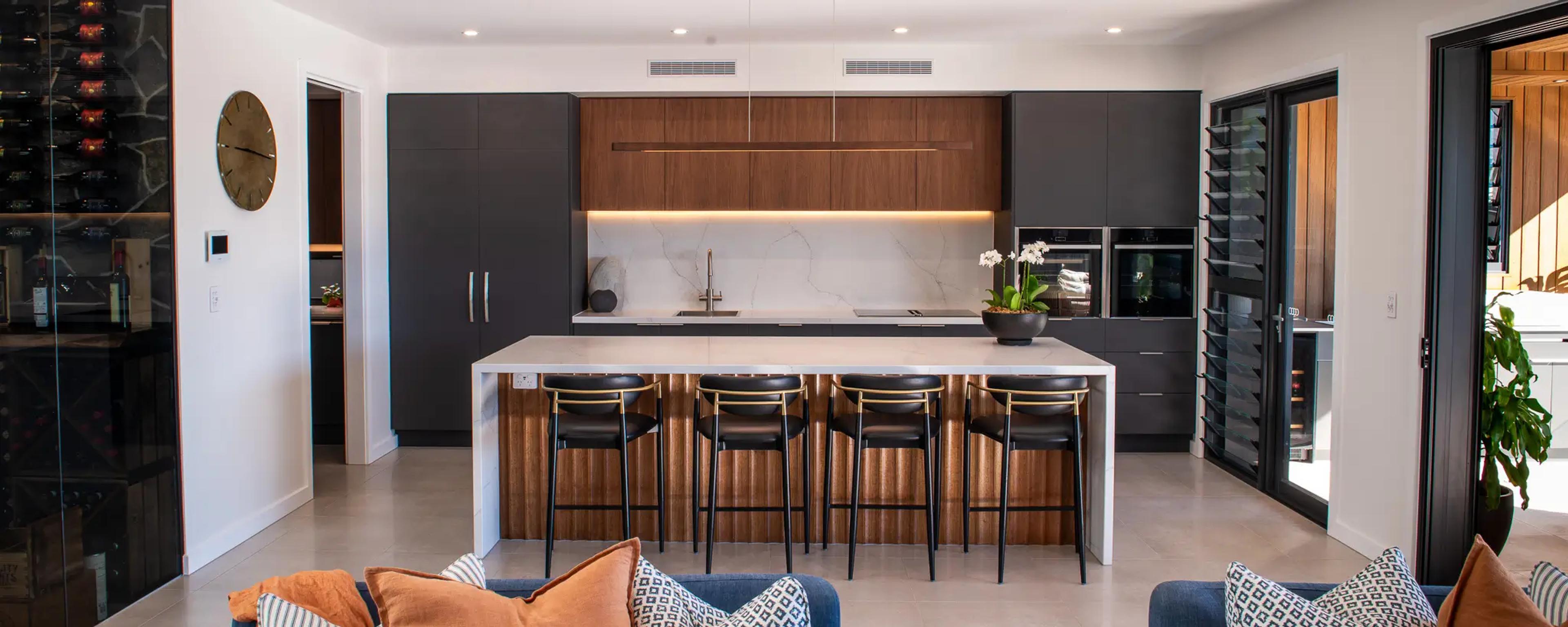 Modern kitchen with timber island and bar stools