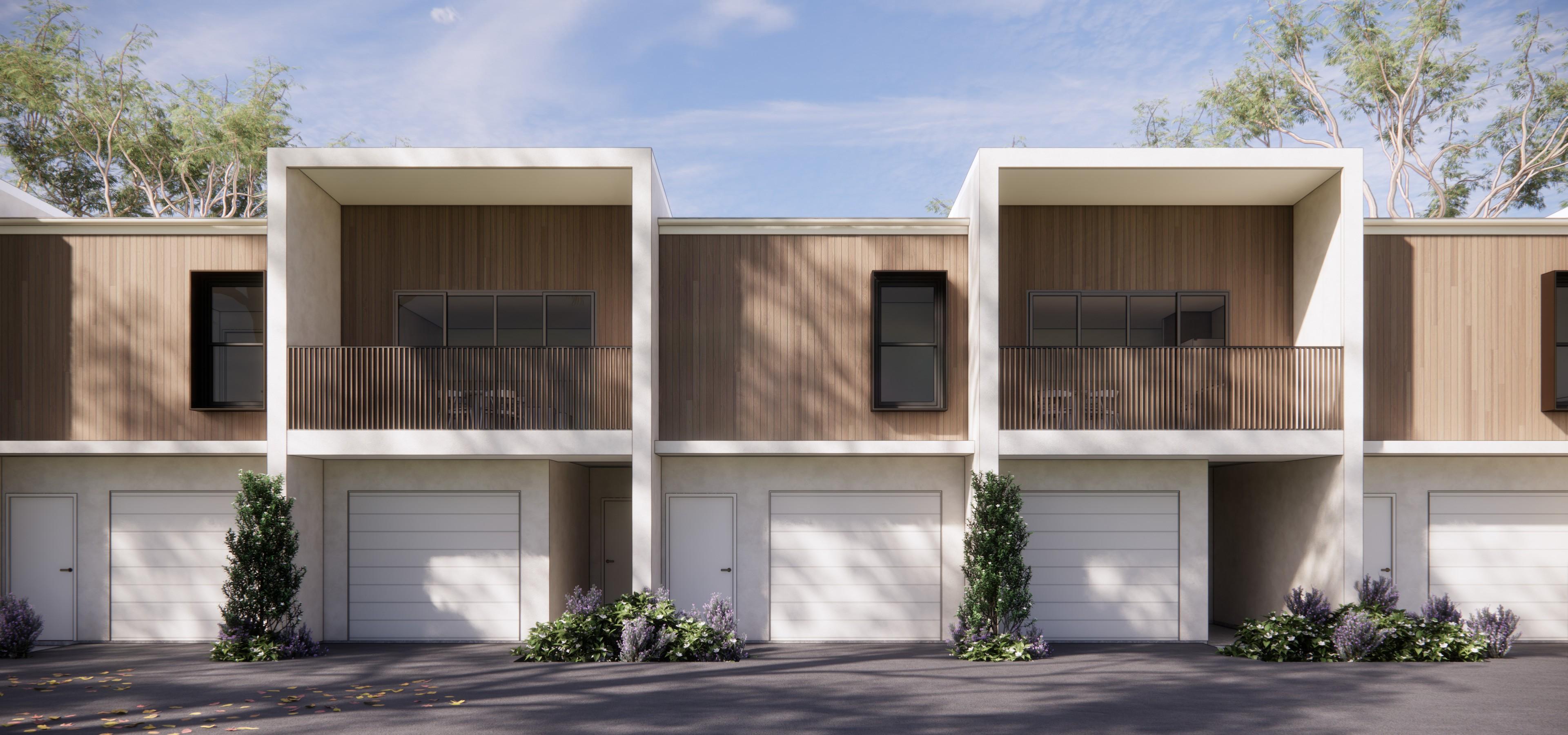 Two storey townhouses with timber cladding and balconies