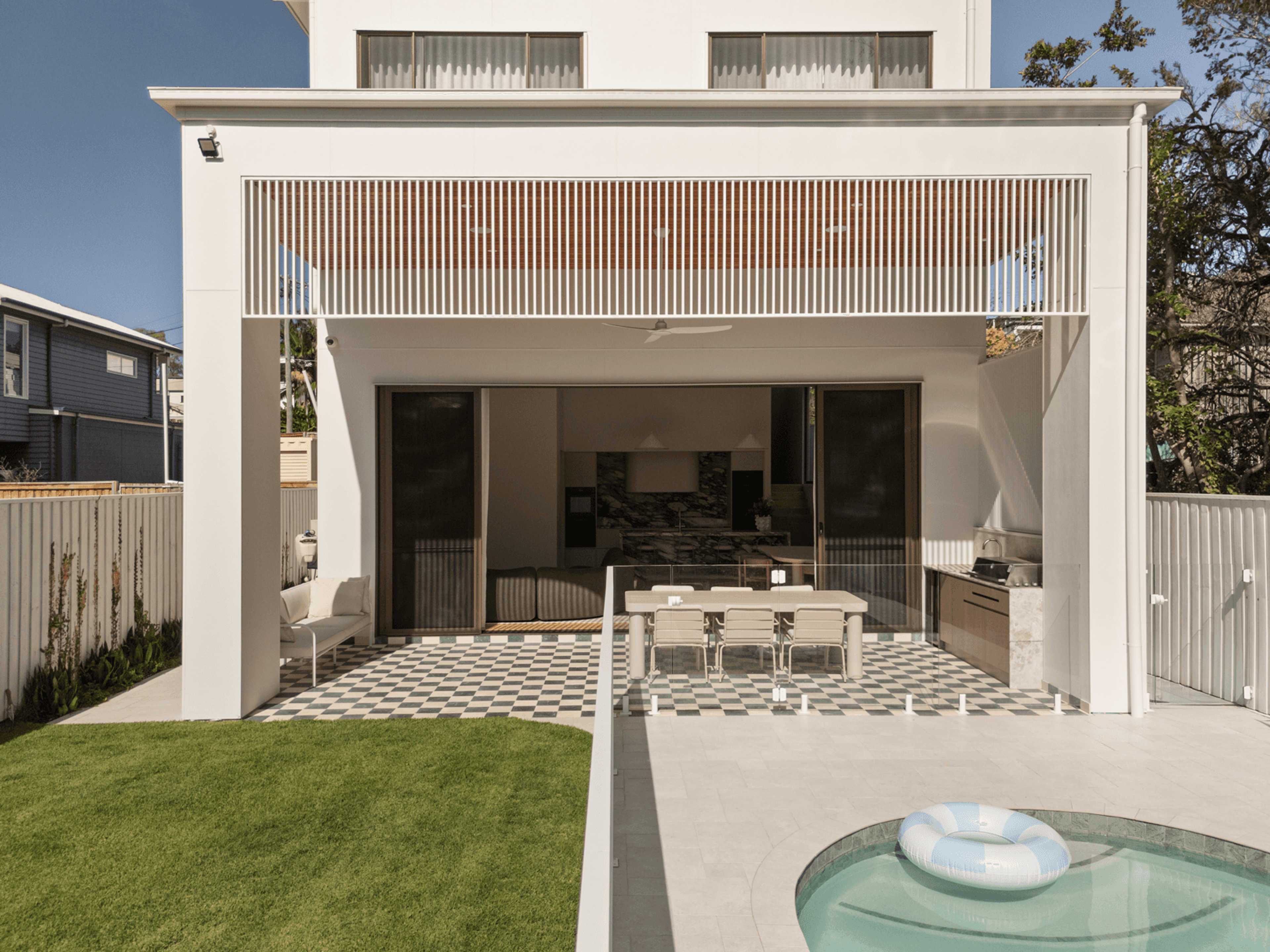 Rear facade with covered alfresco area and swimming pool