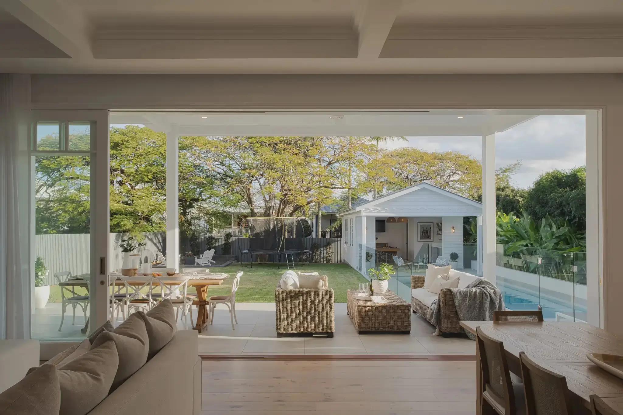 Australian Hamptons home indoor outdoor connection with a pool visible to the right