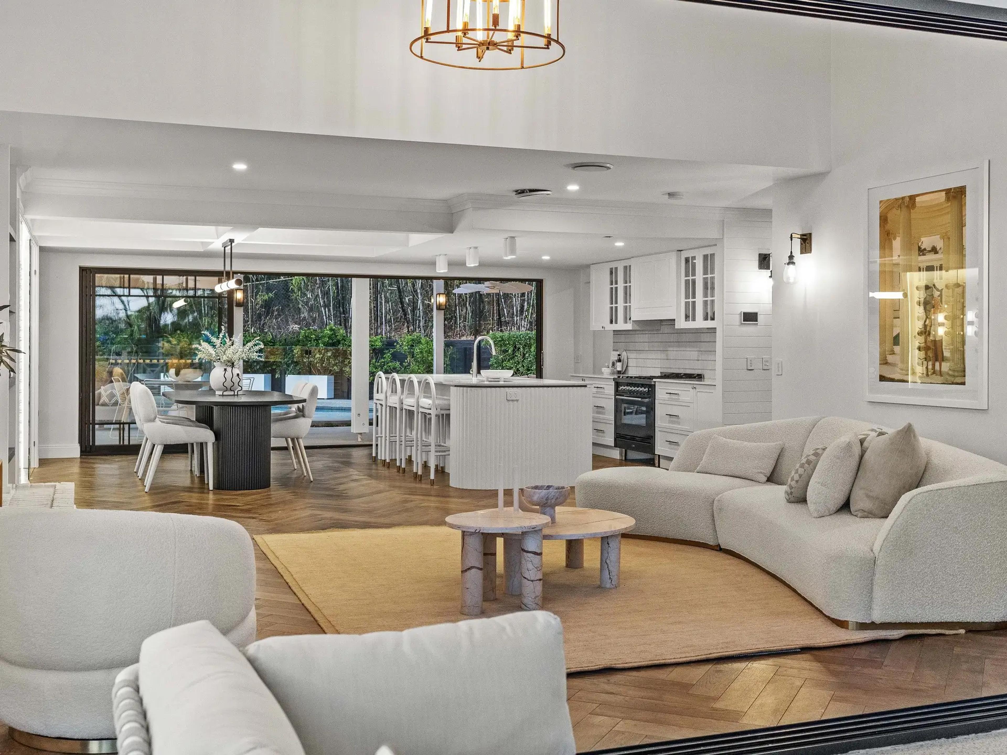 Open plan living room with kitchen and dining beyond