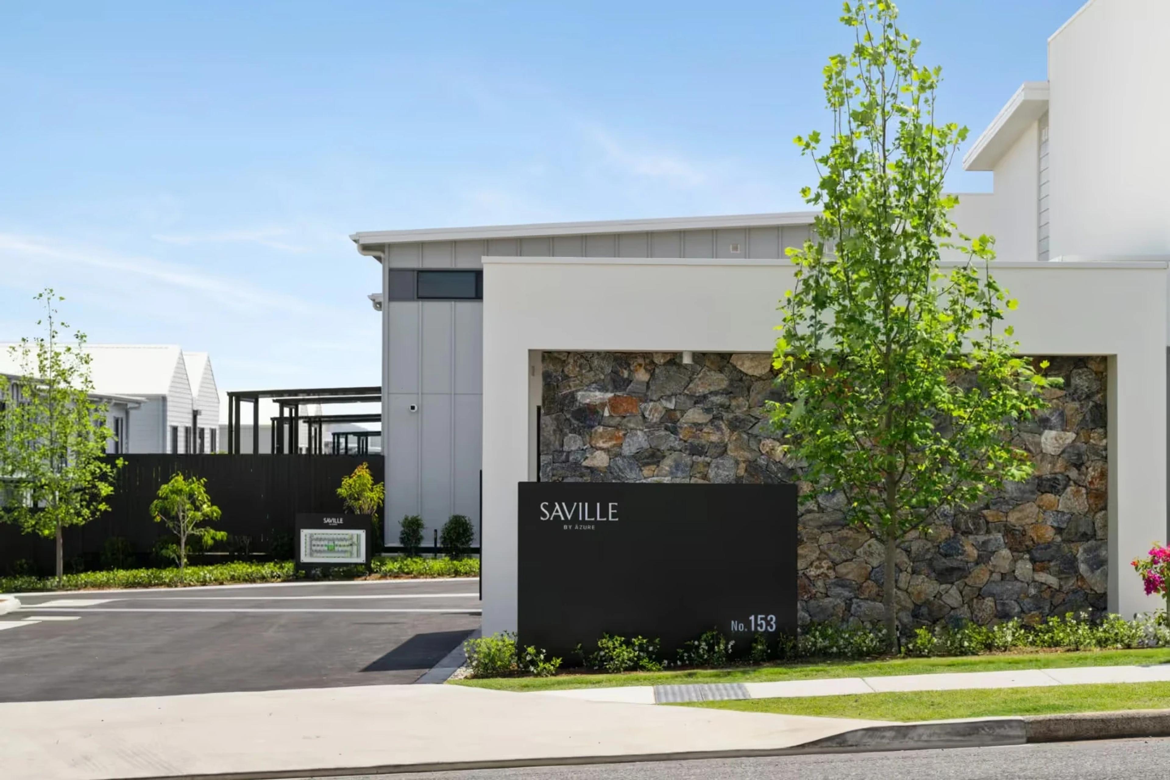 Street entry with stone feature wall and estate signage