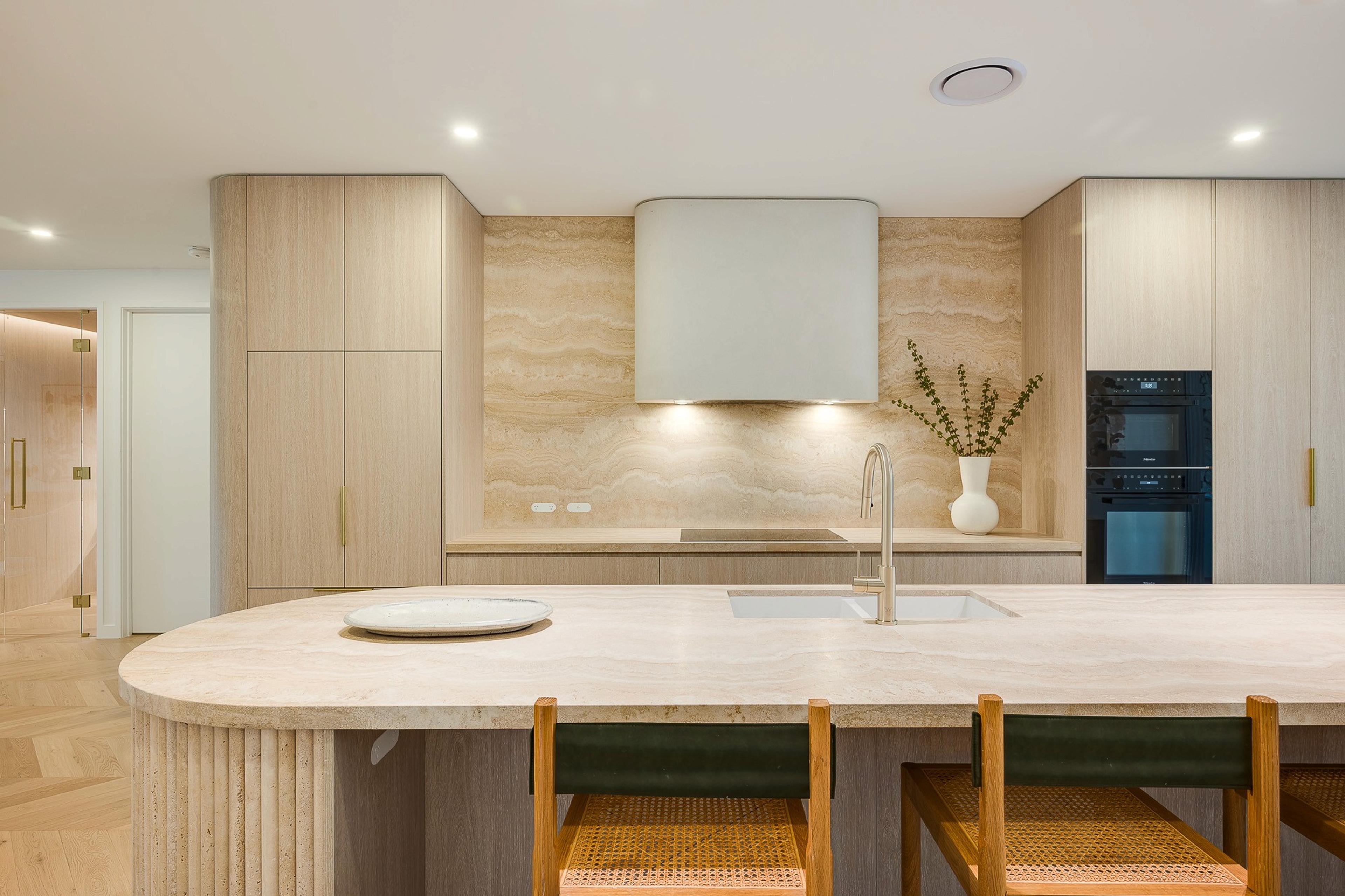Kitchen with stone island and timber joinery