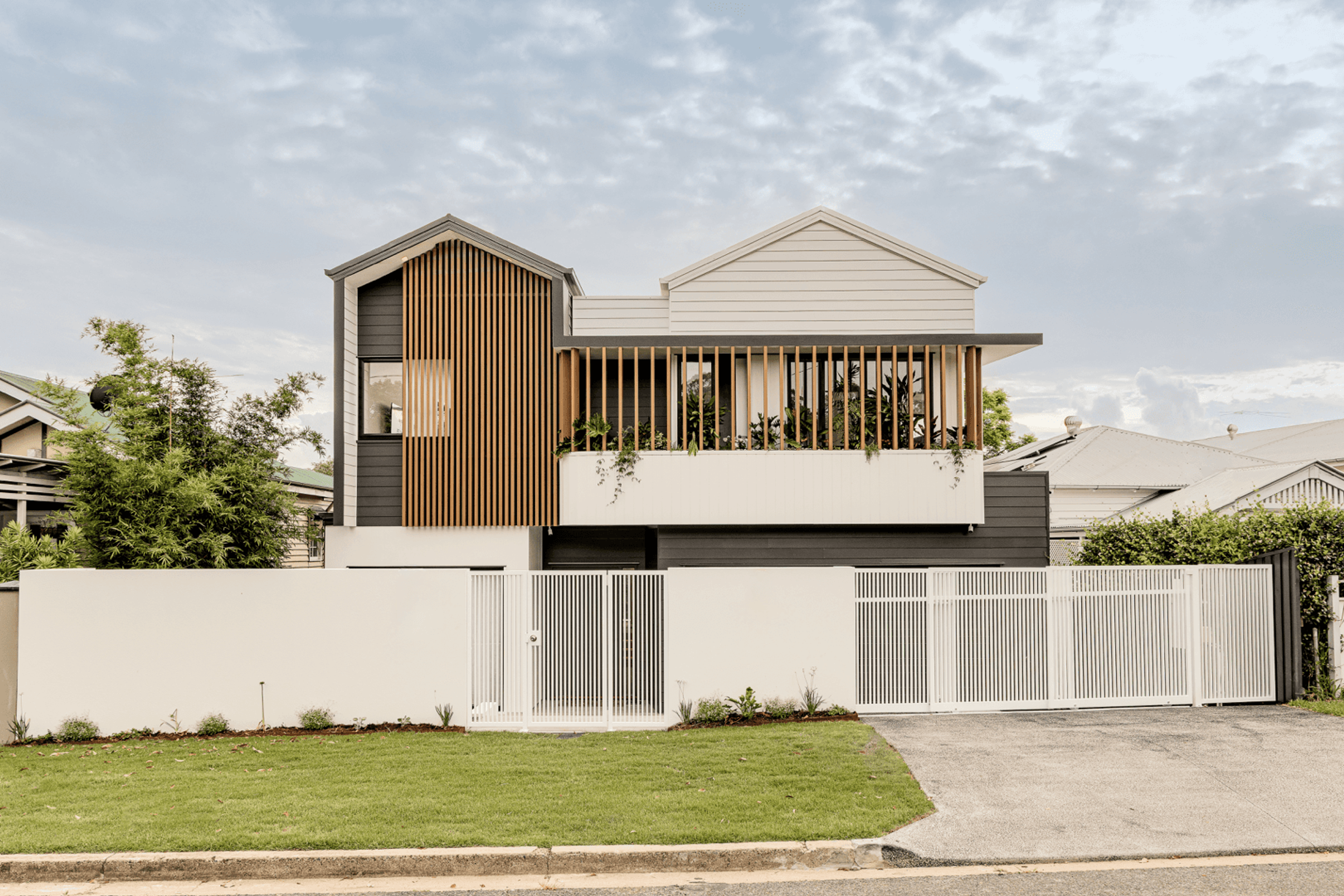 Street facing facade of a modern two storey home with timber battens