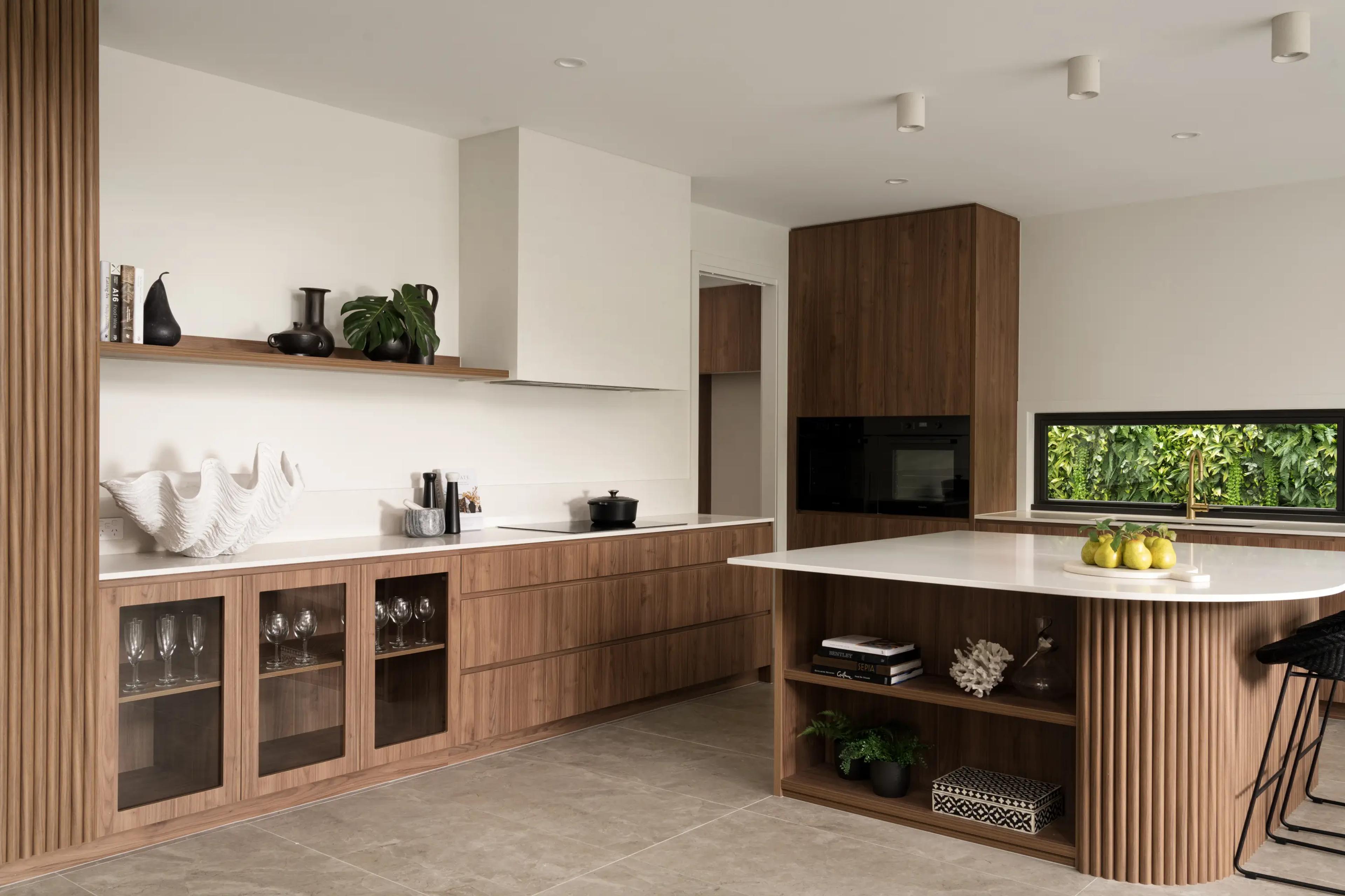 Timber kitchen with white island and range hood