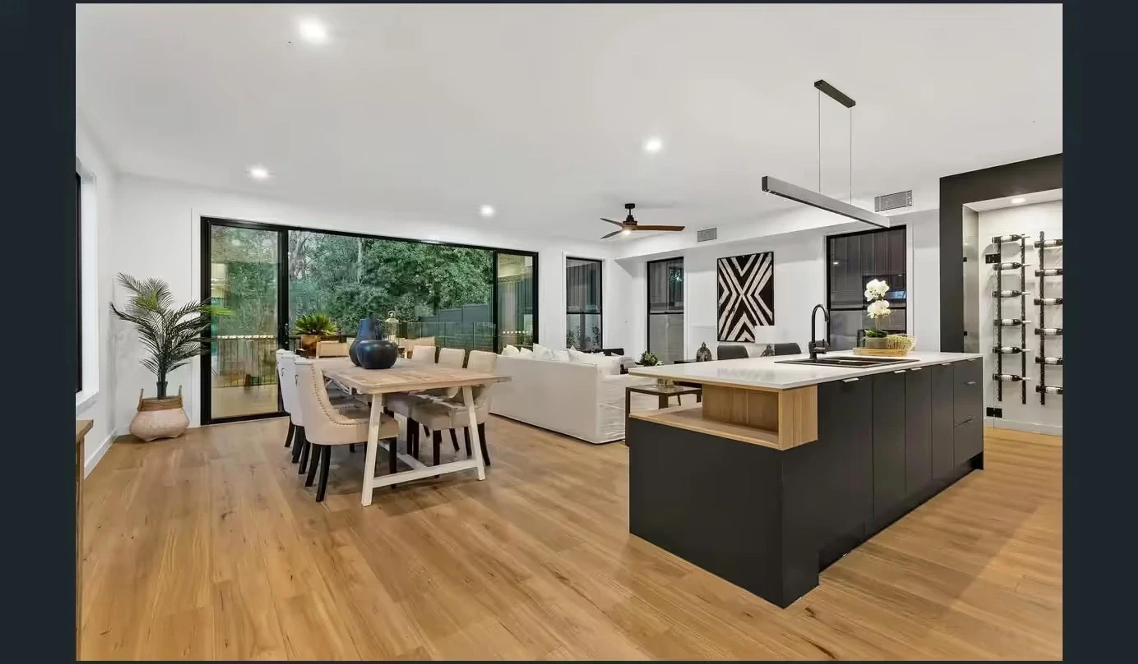 Open plan dining and kitchen with garden outlook