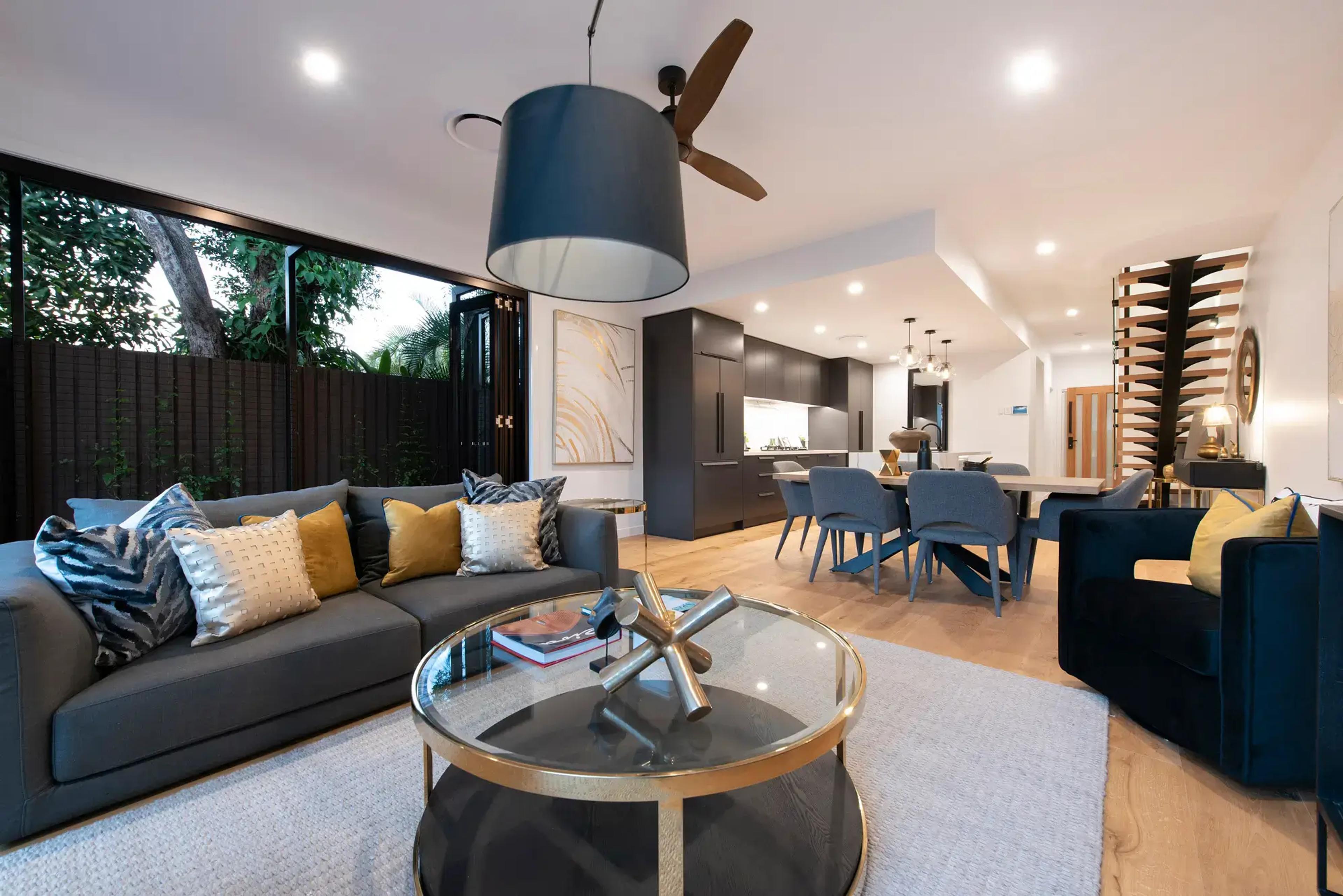 Open plan living room with sofa and dining beyond