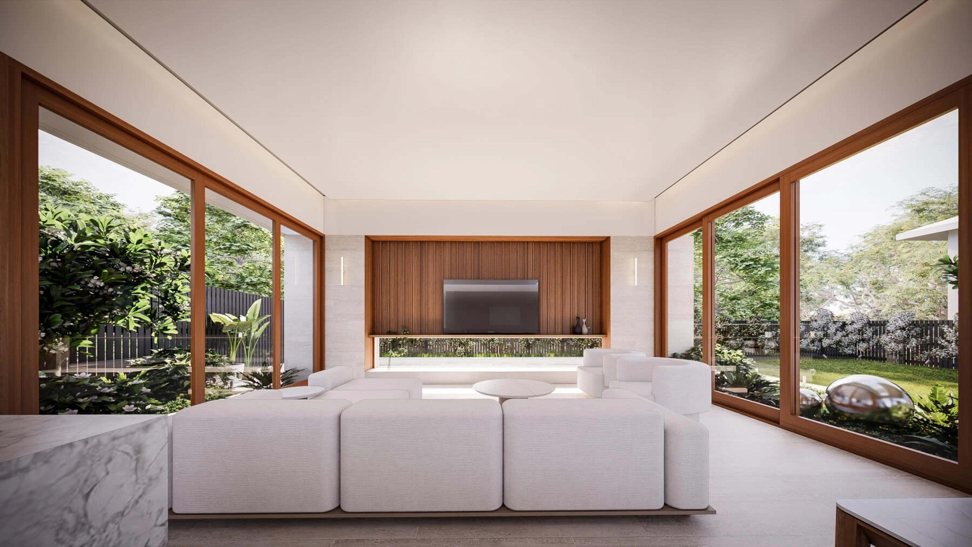 Living room with white sofa, wall mounted television and garden views