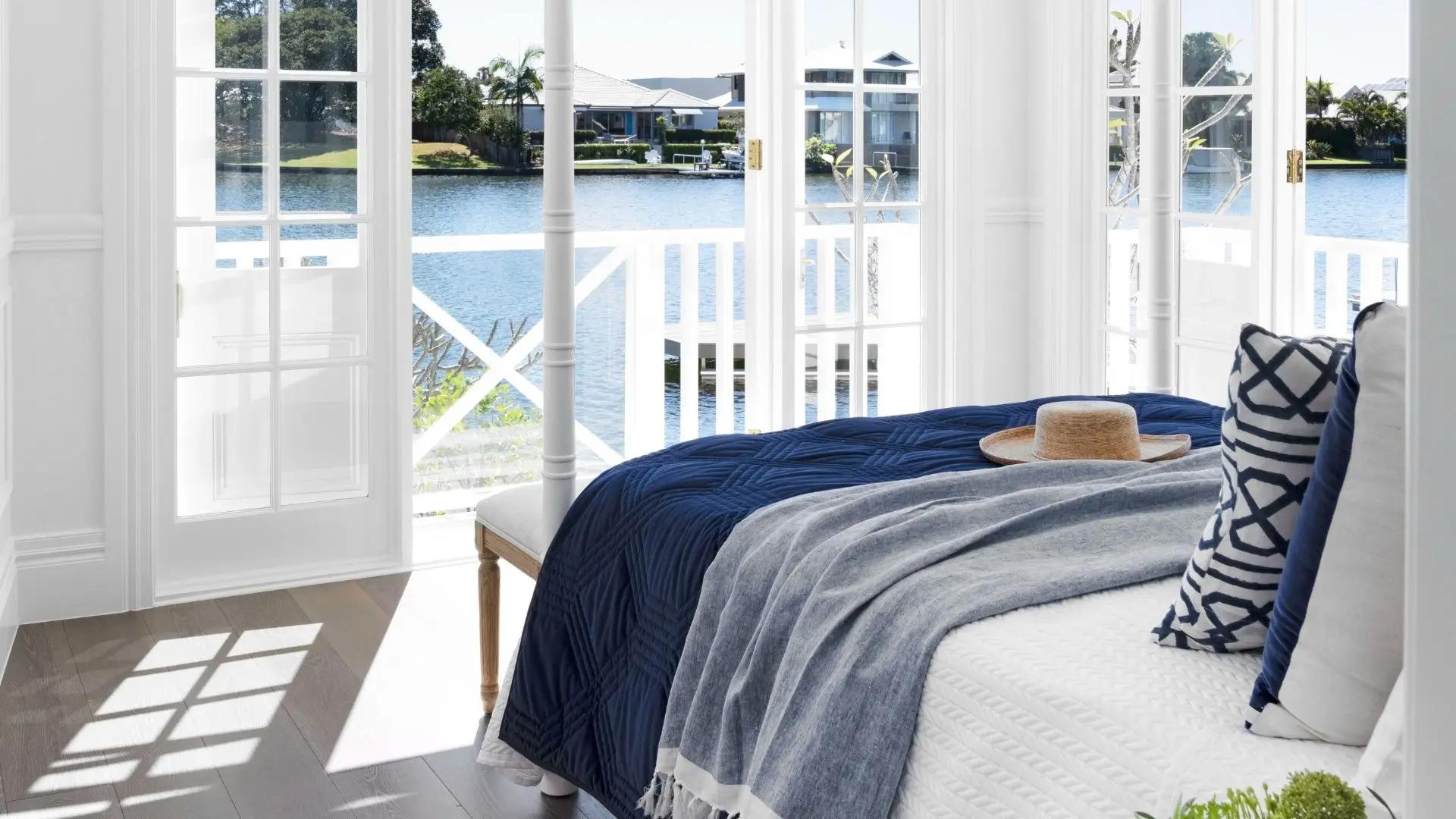 Luxury master bedroom suite with unobstructed canal water views