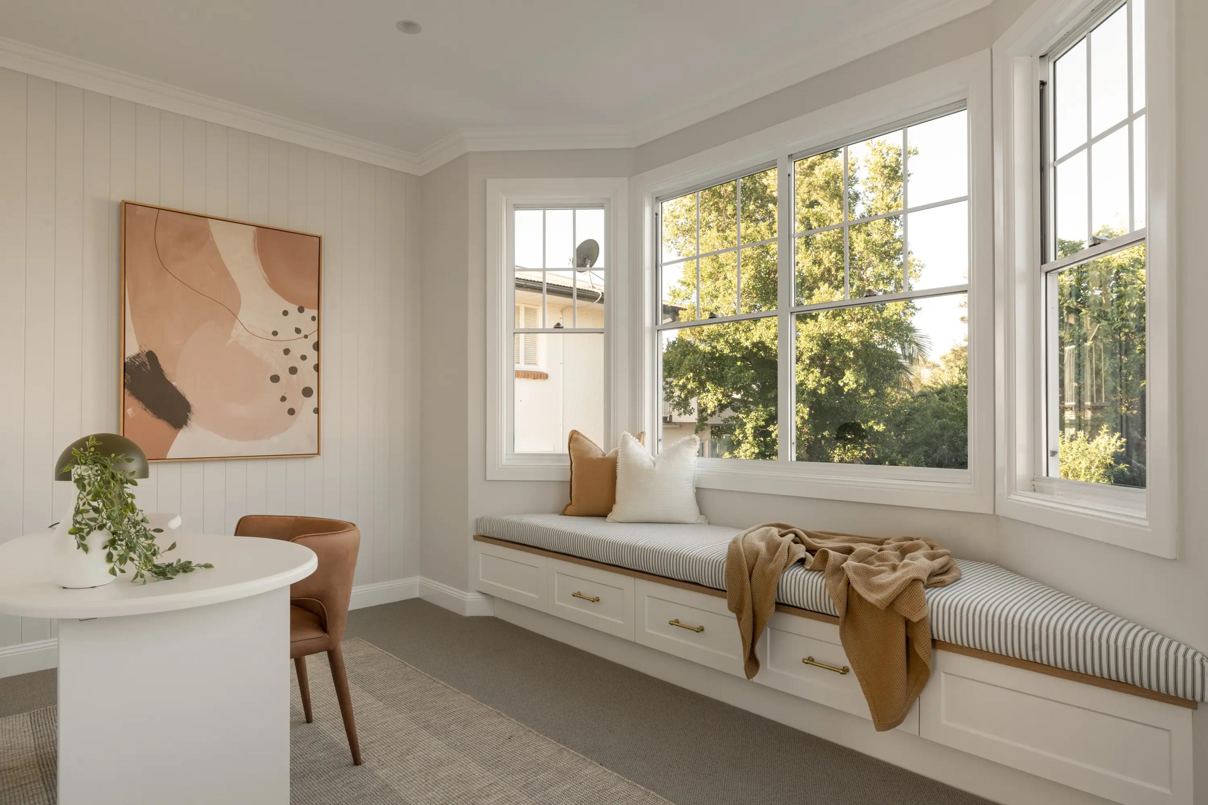 Study nook with window seat and abstract artwork