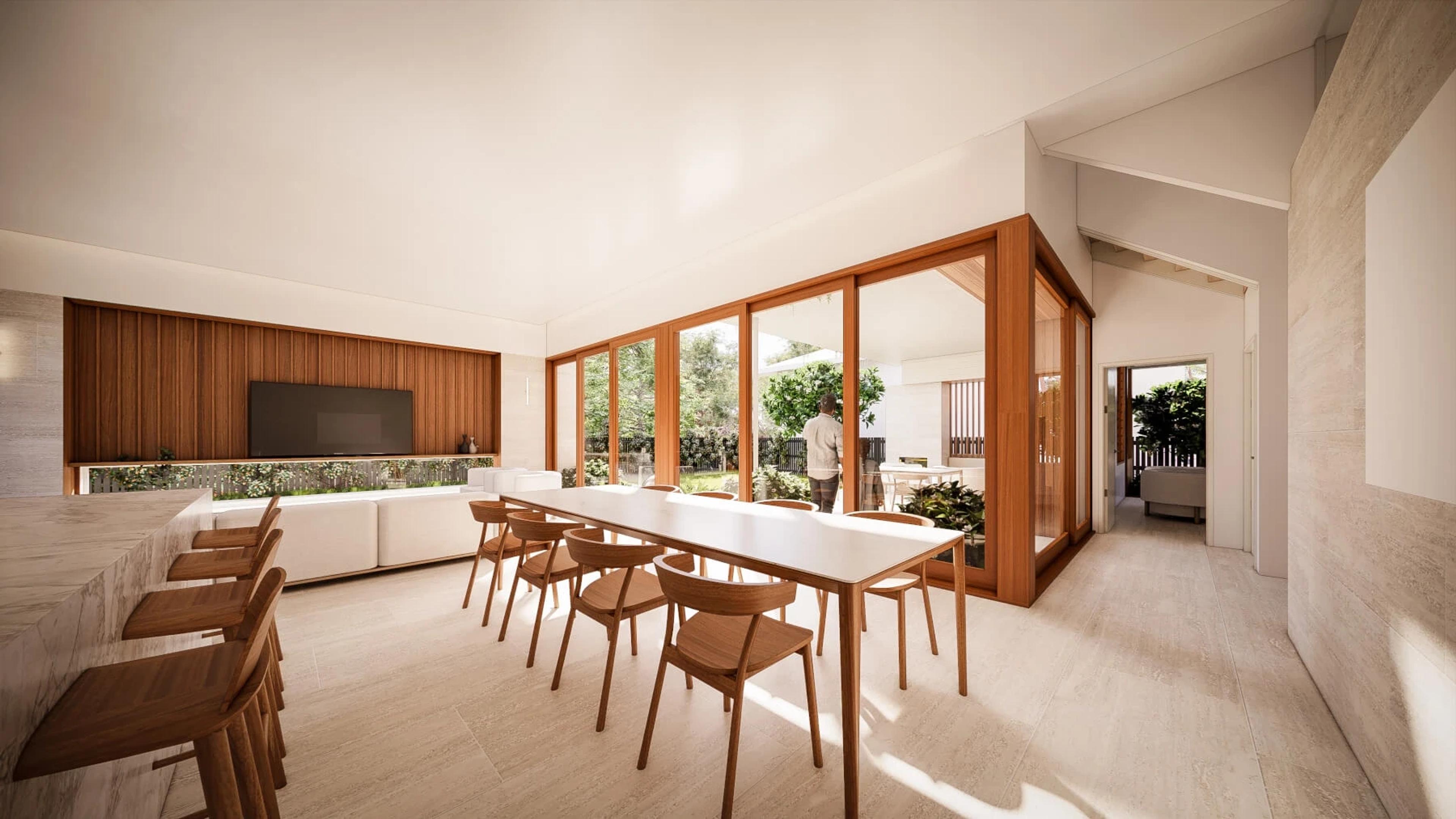 Dining area with long table, timber joinery and courtyard outlook
