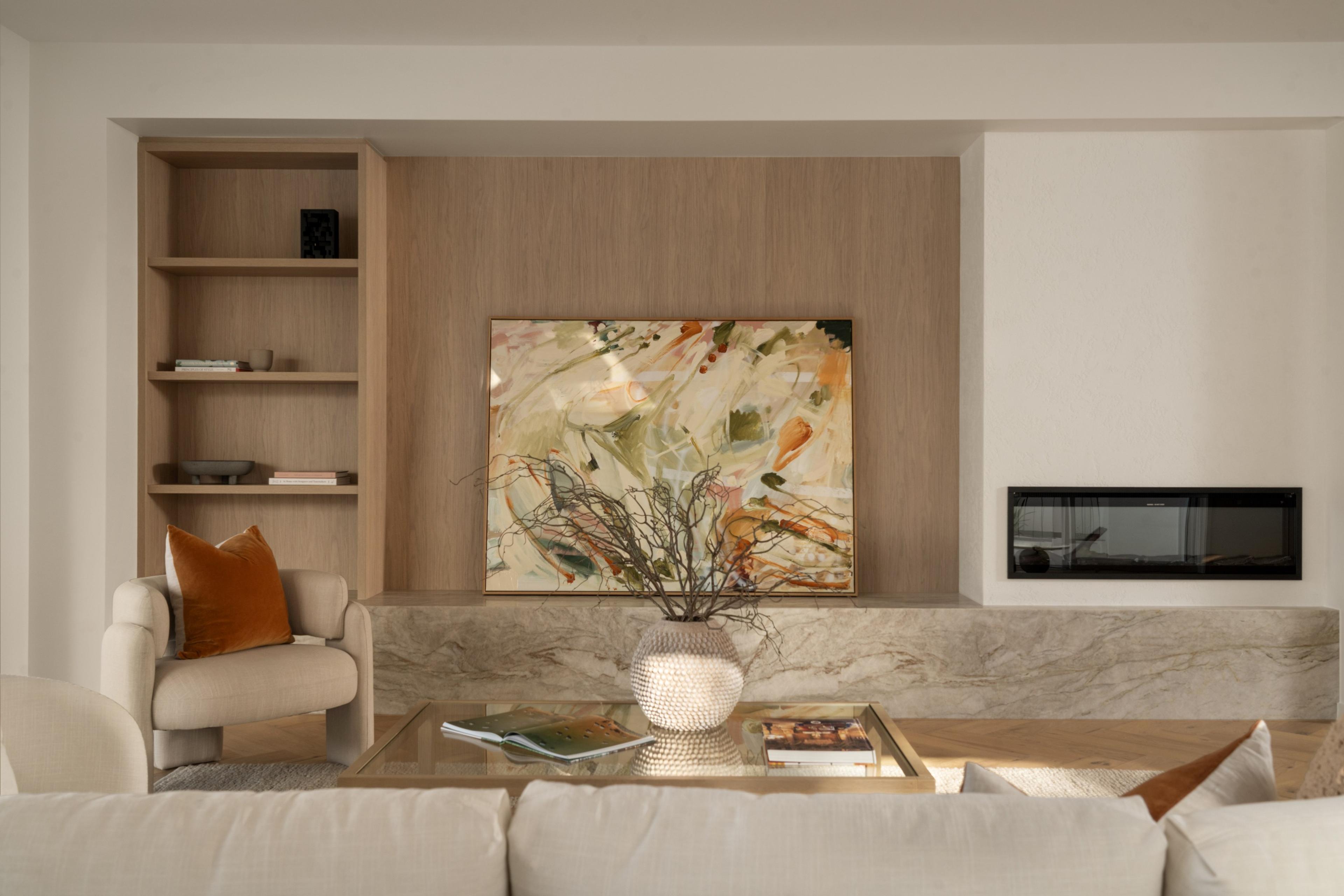 Living room with timber shelving and stone fireplace hearth